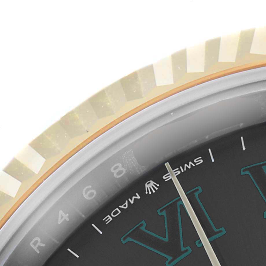 The image shows a close-up of the bezel and part of the dial of a Rolex Datejust 41 126333 Men's Steel and Gold (two tone) Grey Dial 126333 Men's Steel and Gold (two tone) Grey Dial watch.