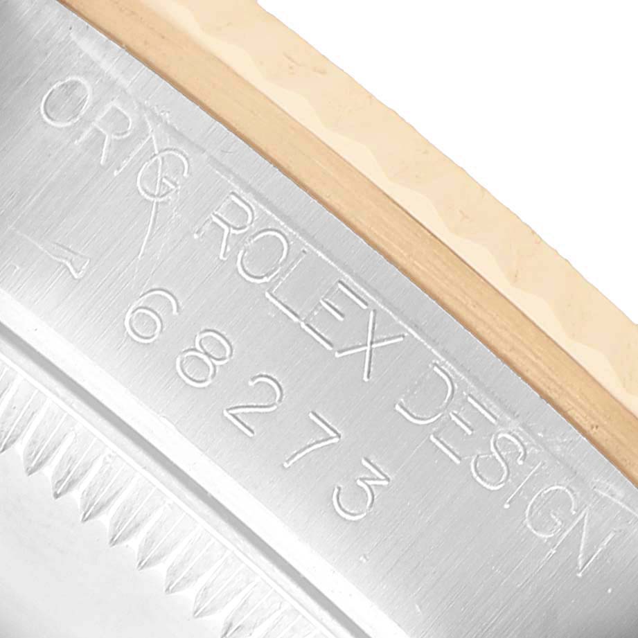 The image shows a close-up of the engraved case side of a Rolex Mid-Size 68273 Women's Steel and Gold (two tone) Champagne Dial watch with the model number 68273.