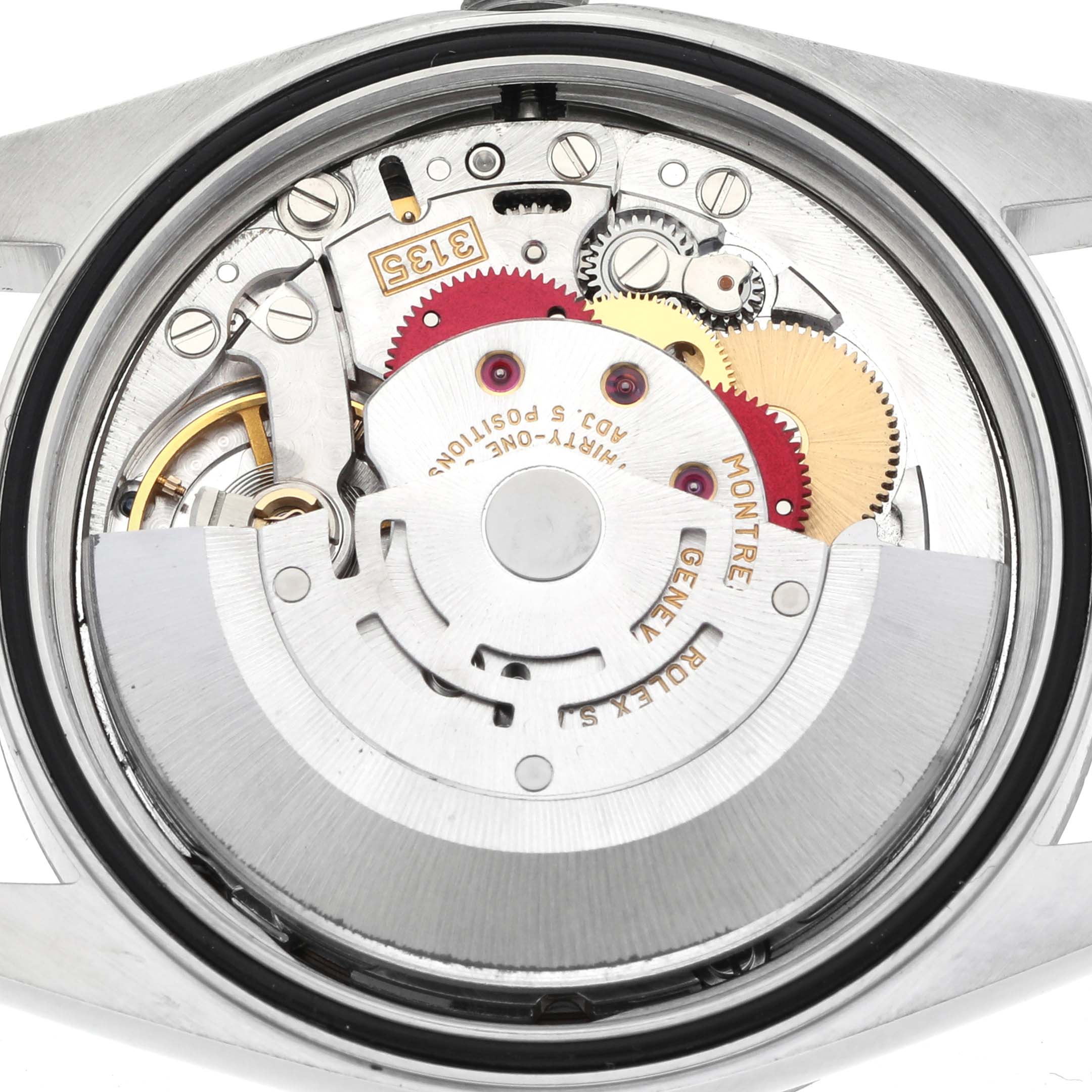 The image shows the movement of a Rolex Datejust 16234 Men's Stainless Steel Mother of Pearl Dial 16234 Men's Stainless Steel Mother of Pearl Dial from a top view, highlighting gears and rotors.