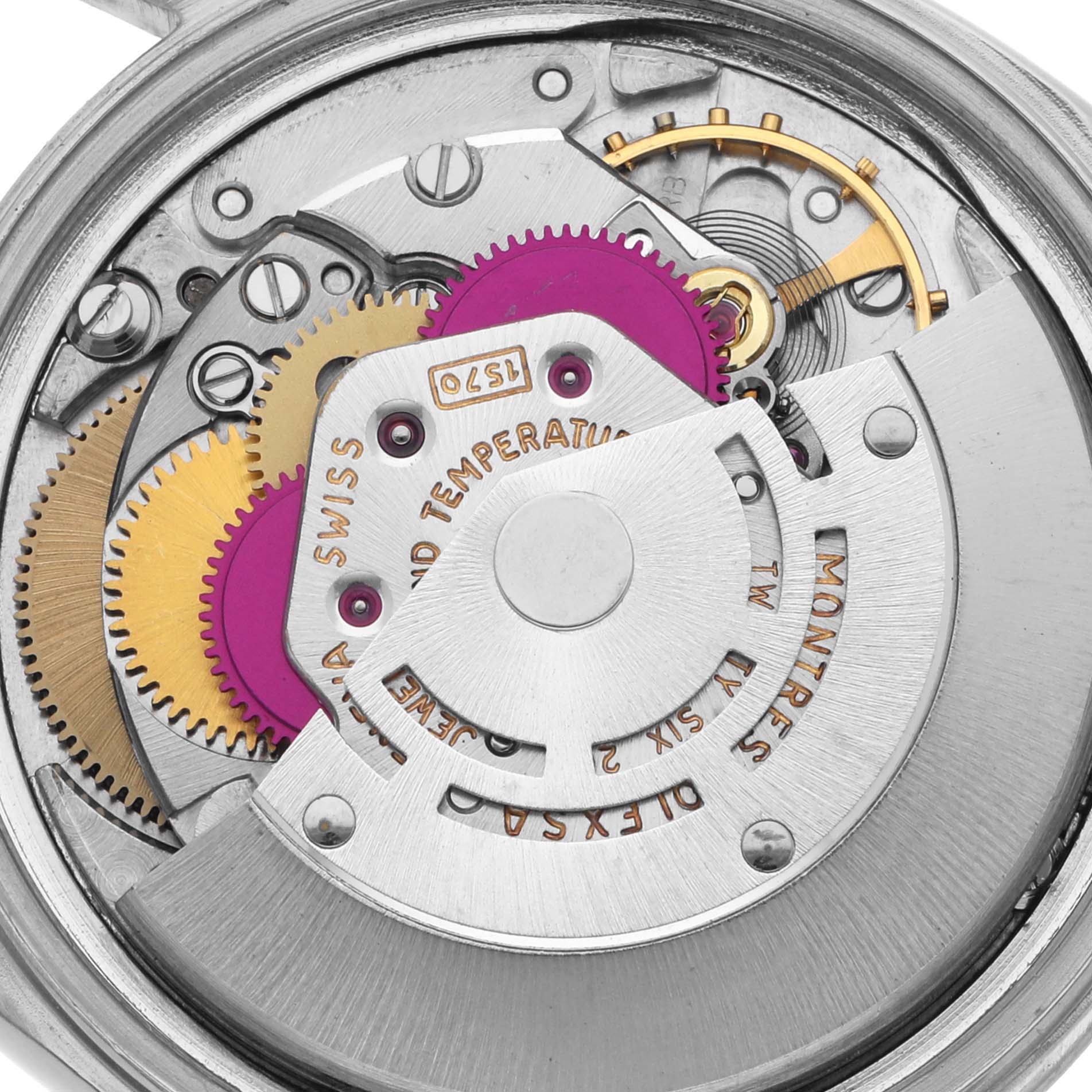 The image shows the detailed internal mechanism of a Rolex Datejust 1603 Men's Stainless Steel Silver Dial 1603 Men's Stainless Steel Silver Dial watch, highlighting the gears and movement components.