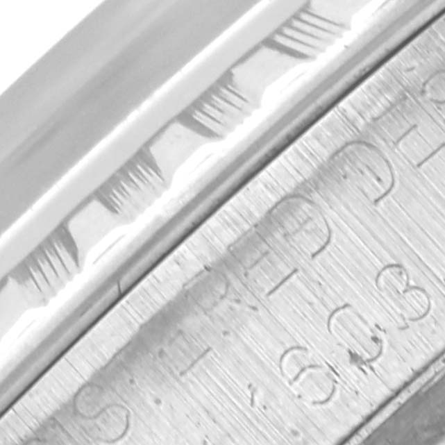 The image shows a close-up of the bezel and engraved details on the Rolex Datejust 1603 Men's Stainless Steel Silver Dial 1603 Men's Stainless Steel Silver Dial watch.