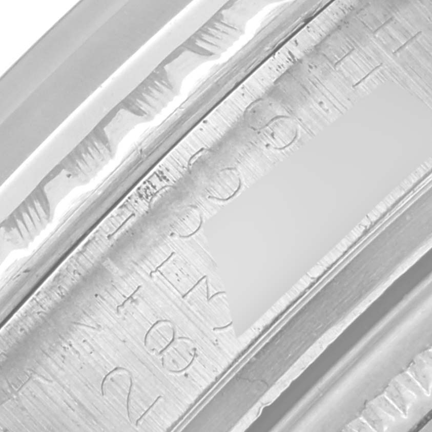 The image shows an angled close-up of the engraved inner bezel of a Rolex Datejust 1603 Men's Stainless Steel Silver Dial 1603 Men's Stainless Steel Silver Dial.