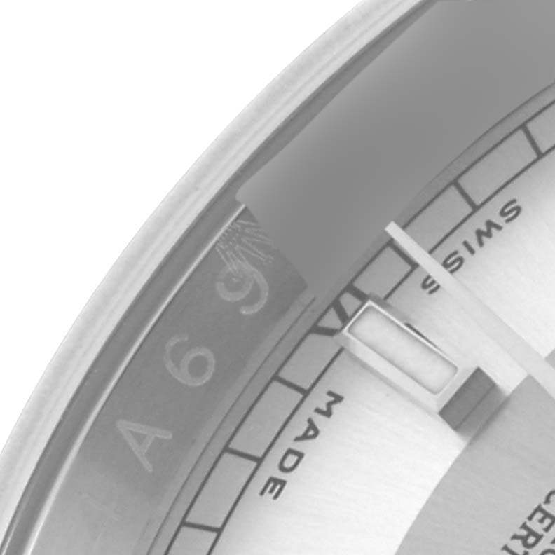 The image shows a partial dial view of a Rolex Datejust 116200 Men's Stainless Steel Silver Dial 116200 Men's Stainless Steel Silver Dial, focusing on the bezel's inner markings and a portion of the dial text.