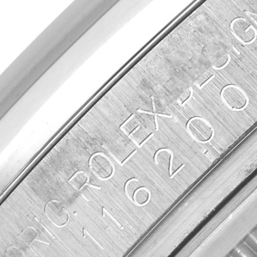 This is a close-up of the engraved side of the case of a Rolex Datejust 116200 Men's Stainless Steel Silver Dial 116200 Men's Stainless Steel Silver Dial, showing part of the serial/production details.