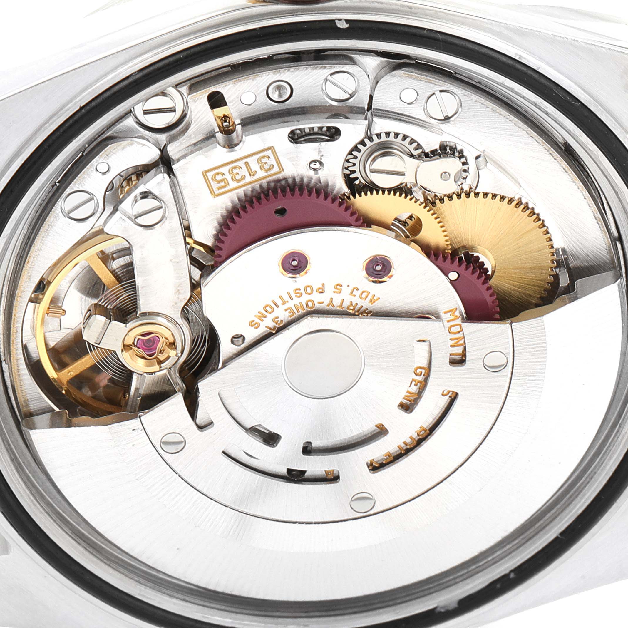 This image shows the movement mechanism of a Rolex Datejust 16233 Men's Steel and Gold (two tone) Champagne Dial 16233 Men's Steel and Gold (two tone) Champagne Dial watch from a close-up angle, detailing its internal gears and components.
