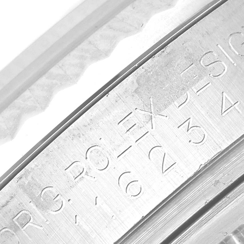 This image shows a close-up view of the engraving on the bezel of a Rolex Datejust 116234 Men's Stainless Steel Black Dial 116234 Men's Stainless Steel Black Dial watch.