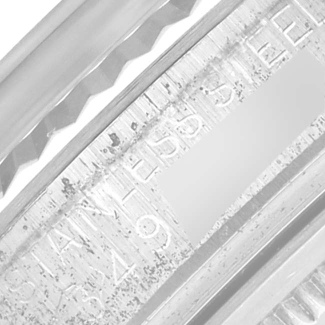 The image shows a close-up of the side engraving detail on a Rolex Datejust 1601 Men's Stainless Steel Grey Dial 1601 Men's Stainless Steel Grey Dial watch, including the fluted bezel edge.