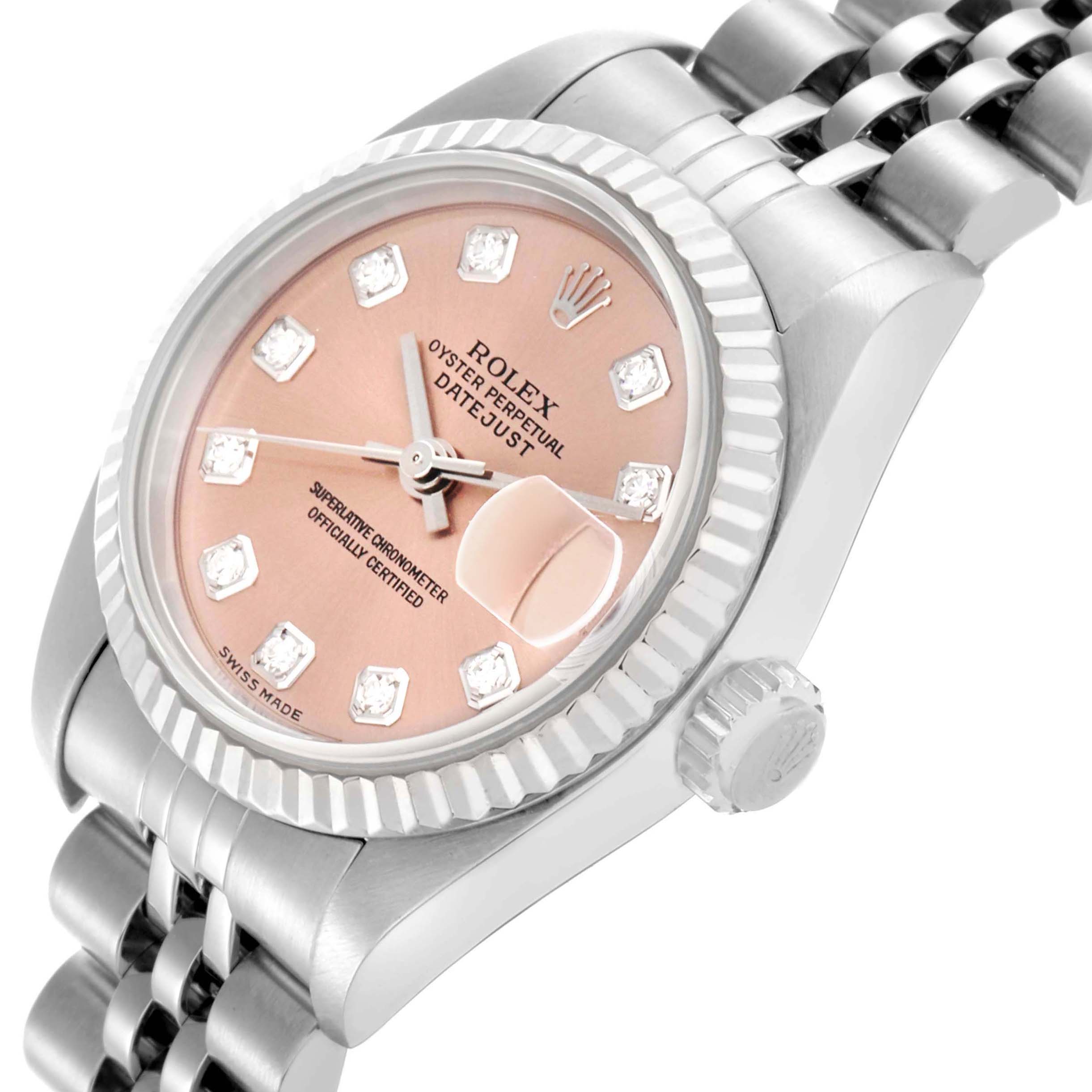 The Rolex Datejust 79174 Women's Stainless Steel Pink Dial 79174 Women's Stainless Steel Pink Dial watch is shown at an angle highlighting the bezel, crown, bracelet, and pink dial with diamond markers.