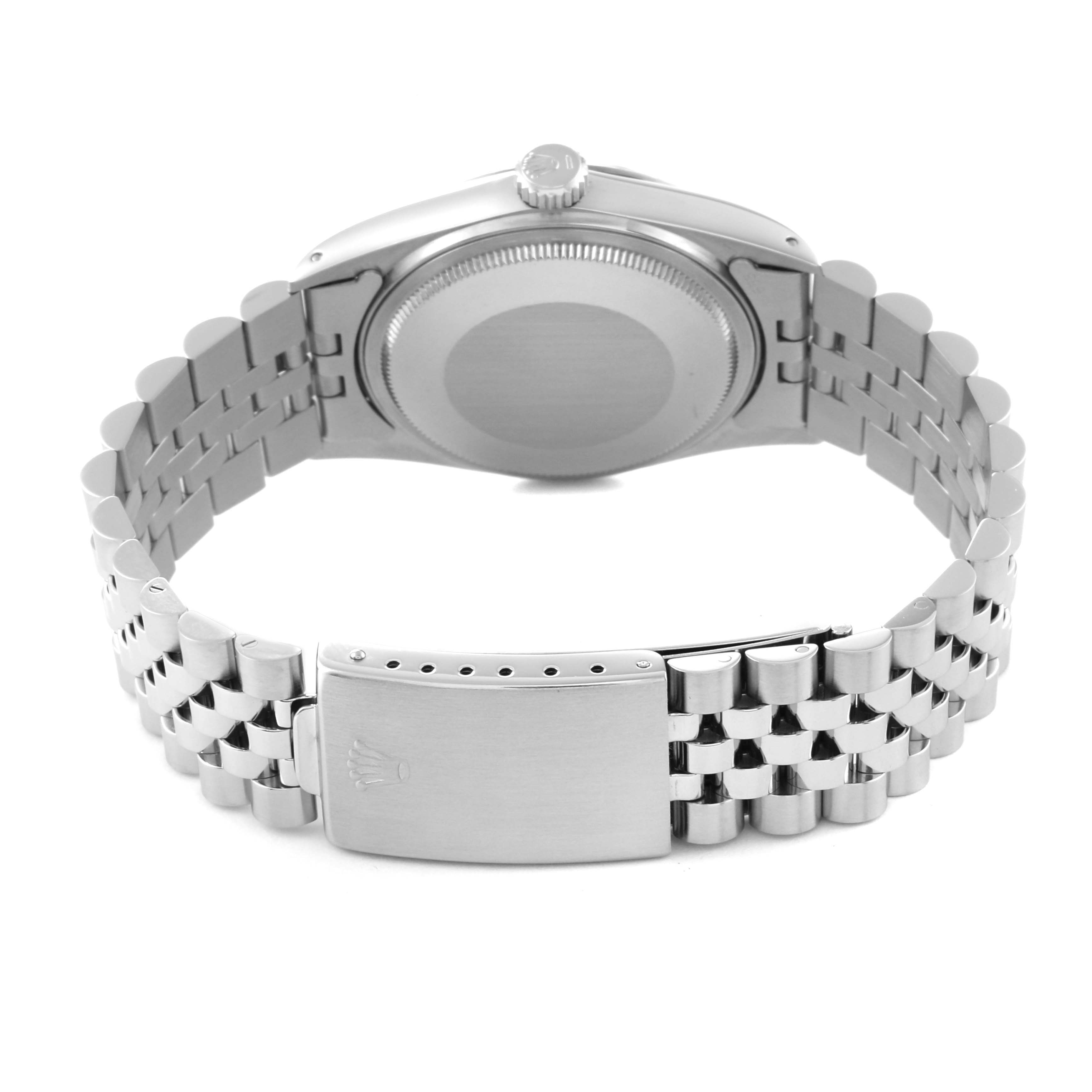 The image shows the back view of a Vintage Collection Rolex watch, highlighting its case back, jubilee bracelet, and clasp.