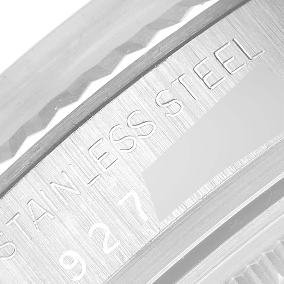 This close-up image shows the stainless steel engraving on the casing of a Rolex Vintage Collection 16014 Men's Stainless Steel Silver Dial 16014 Men's Stainless Steel Silver Dial model.