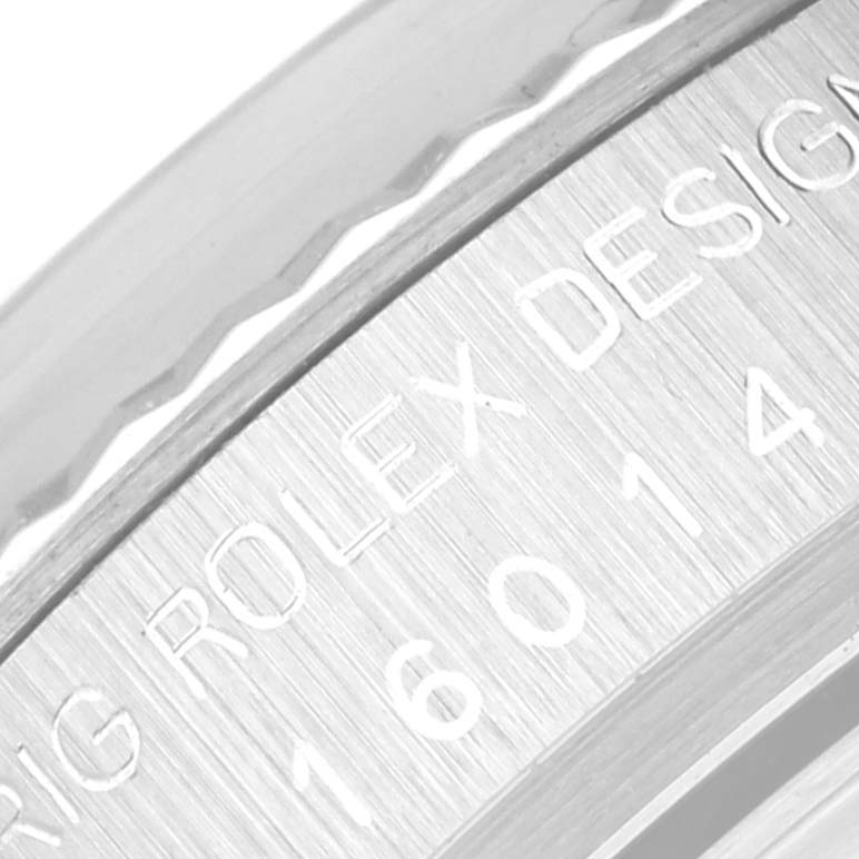 This close-up image of the Rolex Vintage Collection 16014 Men's Stainless Steel Silver Dial 16014 Men's Stainless Steel Silver Dial model shows the engraved text on its stainless steel bezel.