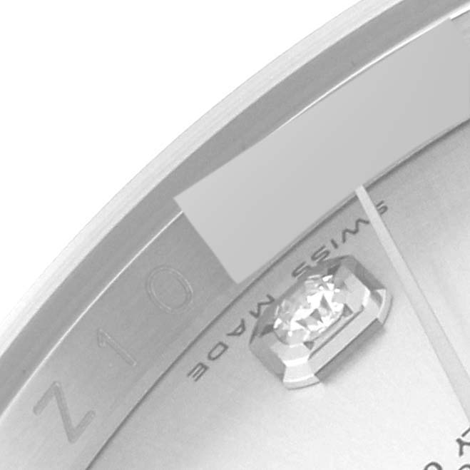 The image shows a close-up of a Rolex Datejust 116234 Men's Stainless Steel Silver Dial 116234 Men's Stainless Steel Silver Dial watch dial, highlighting the bezel, diamond hour marker, and part of the logo.