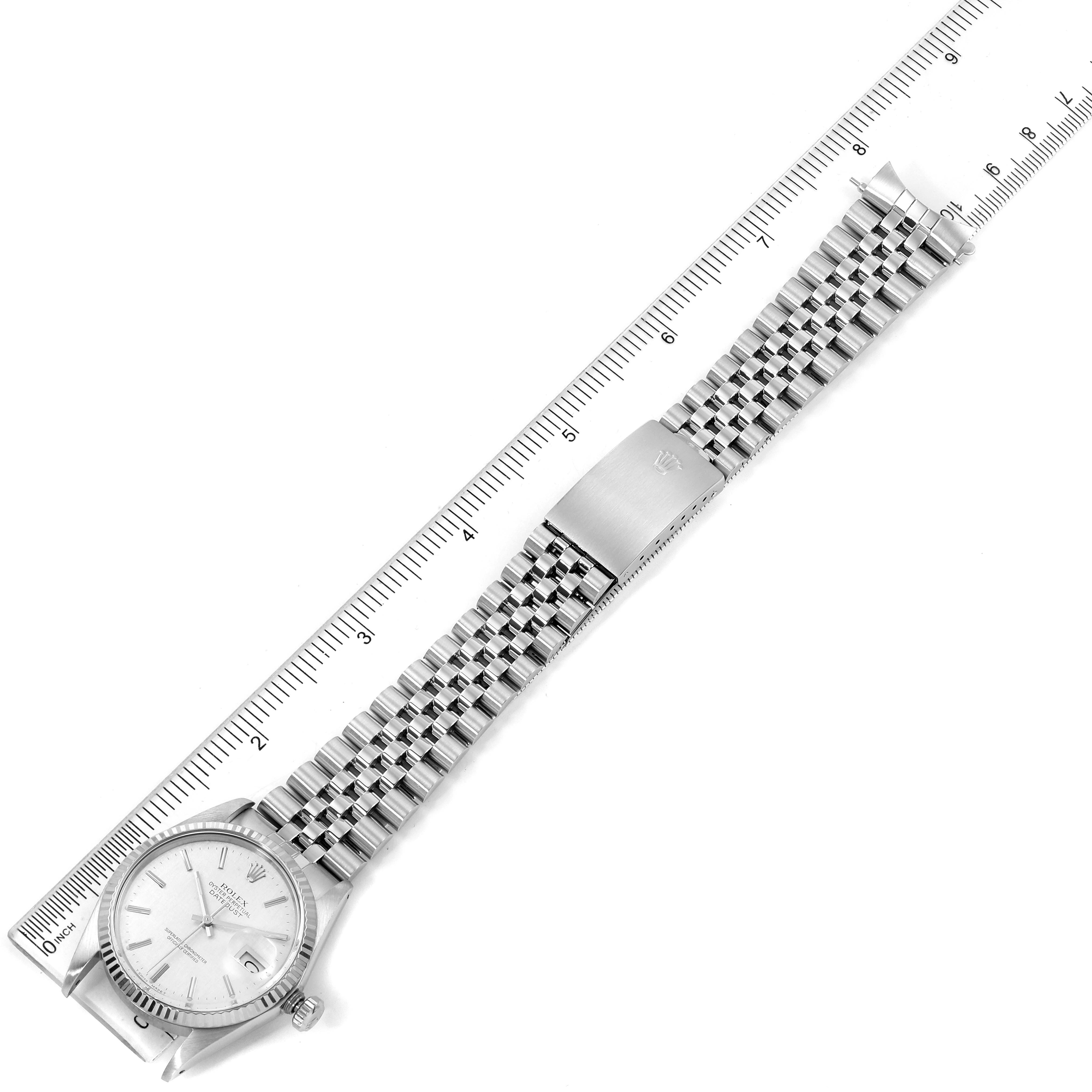 The image shows a top view of a Vintage Collection Rolex watch with a stainless steel bracelet next to a ruler.