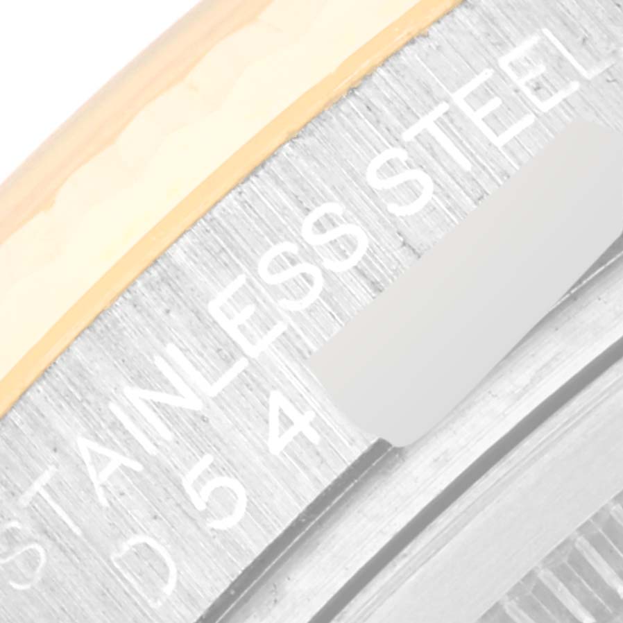 The image shows a close-up of the bezel and part of the case engravings on a Rolex Datejust 116233 Men's Steel and Gold (two tone) Blue Dial 116233 Men's Steel and Gold (two tone) Blue Dial watch.