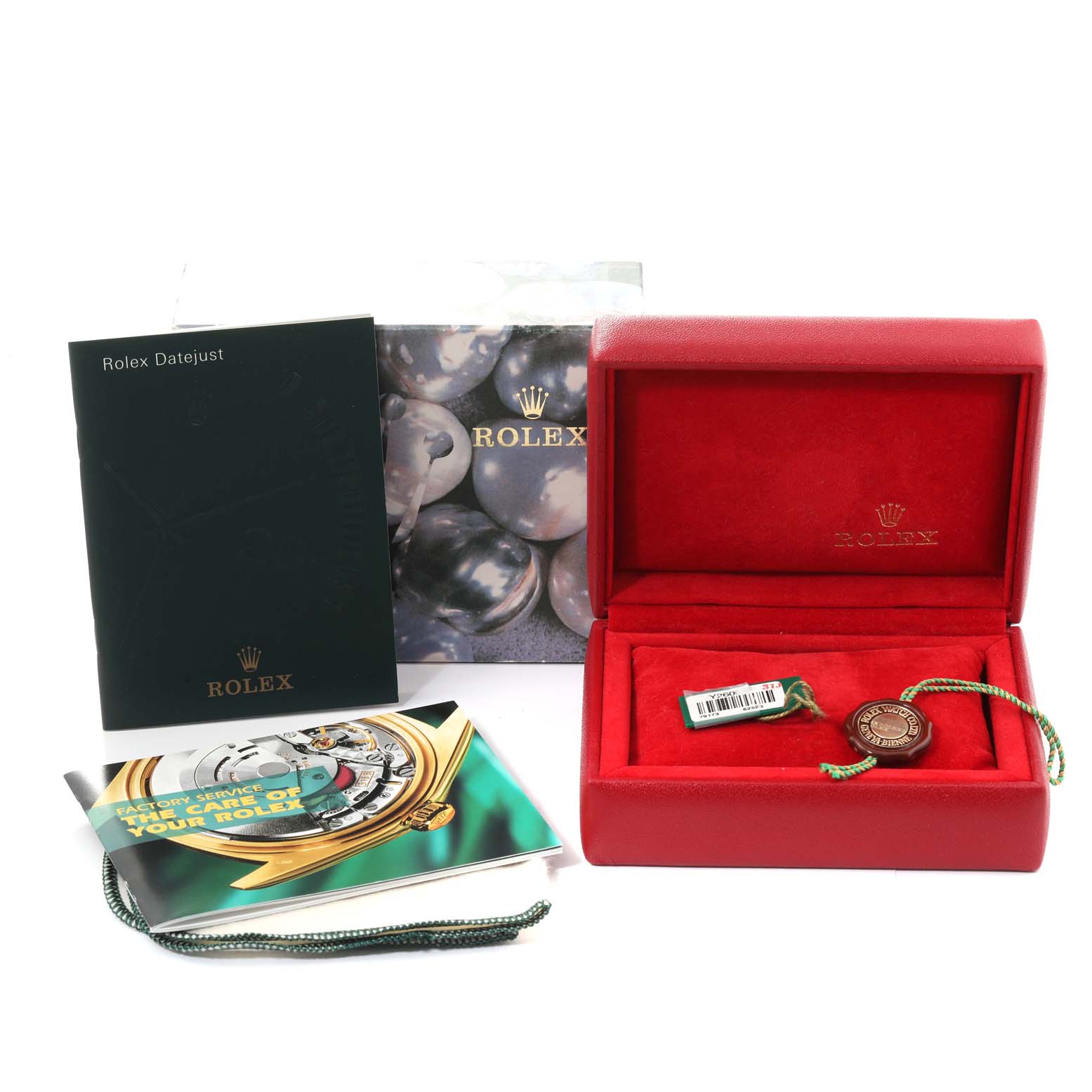 The image shows Rolex Datejust 79173G Women's Steel and Gold (two tone) Champagne Dial 79173G Women's Steel and Gold (two tone) Champagne Dial accessories including a red box, booklets, a tag, and packaging materials.