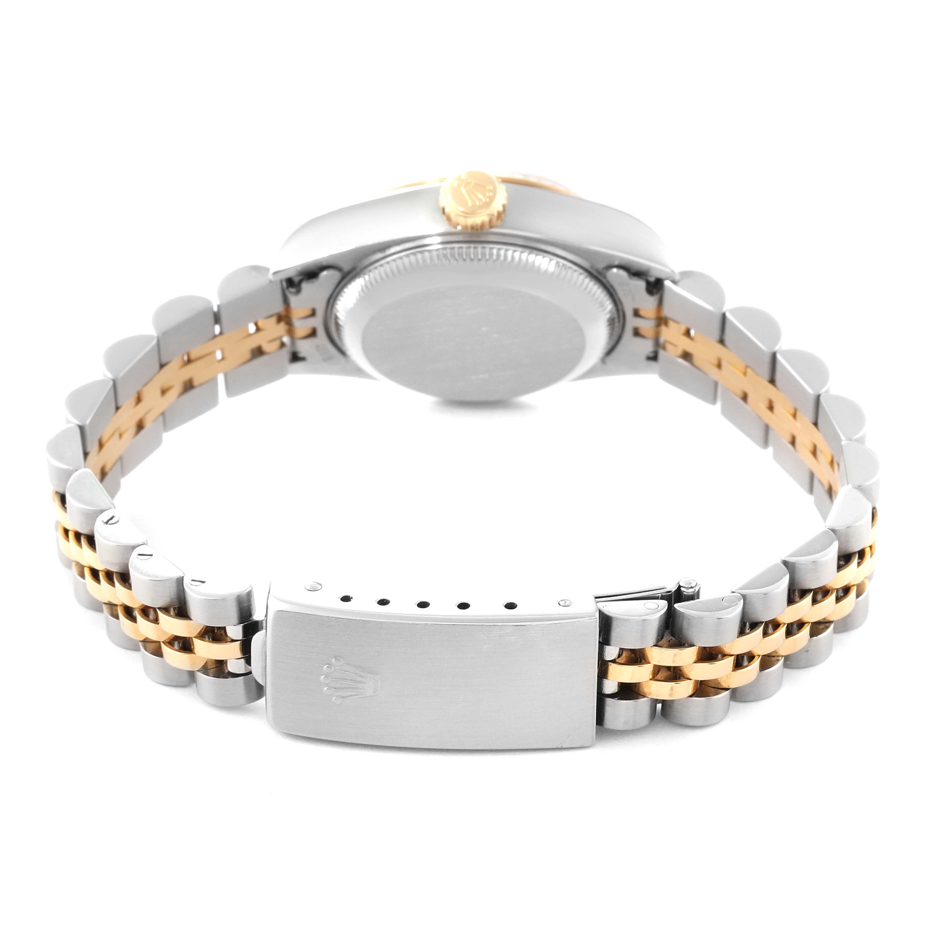 The image shows the back view of a Rolex Datejust 79173G Women's Steel and Gold (two tone) Champagne Dial 79173G Women's Steel and Gold (two tone) Champagne Dial watch, highlighting its case, crown, and two-tone bracelet with clasp.