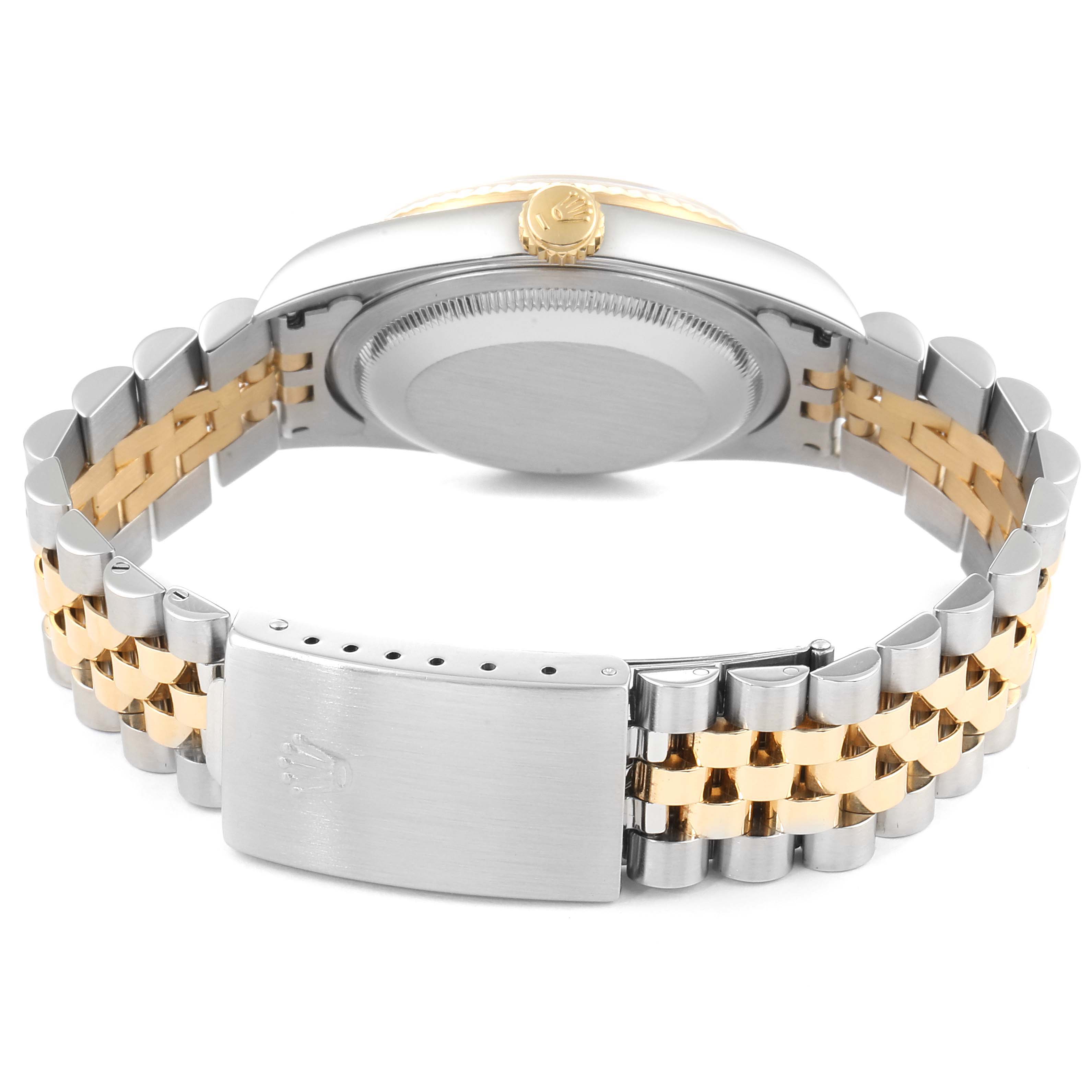 This image shows the back of a Rolex Datejust 16233 Men's Steel and Gold (two tone) Champagne Dial 16233 Men's Steel and Gold (two tone) Champagne Dial watch, highlighting the case back, crown, and two-tone bracelet with the clasp closed.