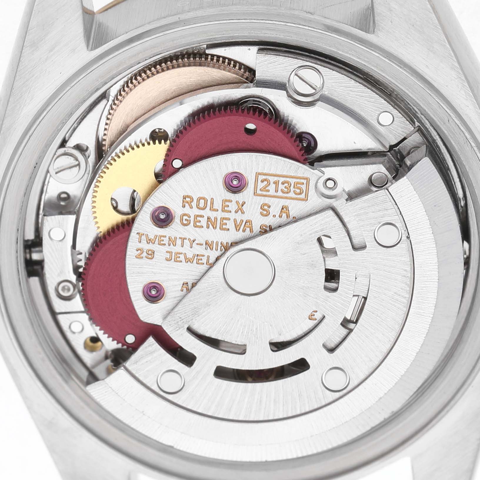 The image shows the movement of a Rolex Datejust 69173 Women's Steel and Gold (two tone) Champagne Dial, highlighting gears and components from a rear angle.