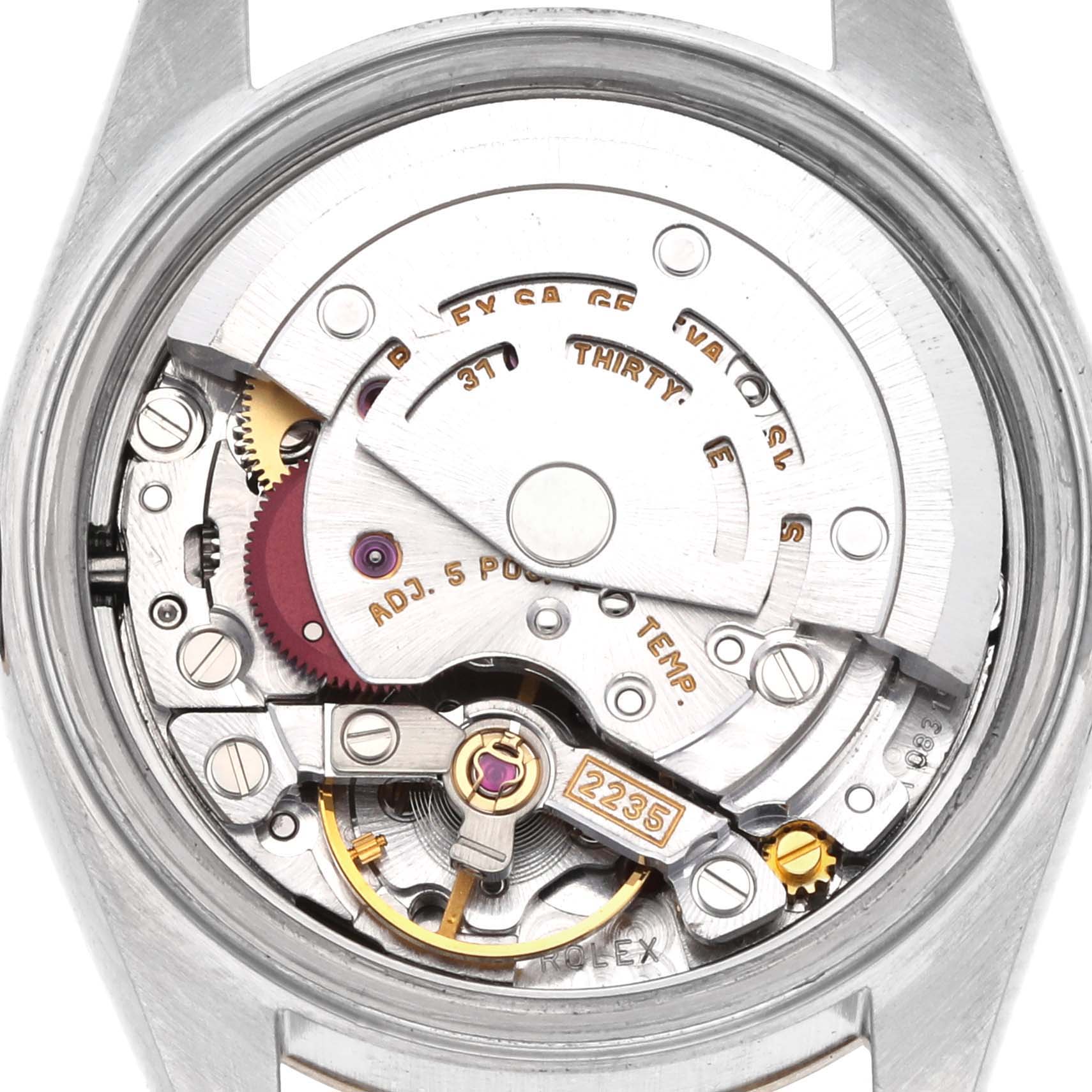 The image shows the movement of a Rolex Datejust 79173 Women's Steel and Gold (two tone) Champagne Dial 79173 Women's Steel and Gold (two tone) Champagne Dial, highlighting internal components and mechanical gears from a rear view angle.