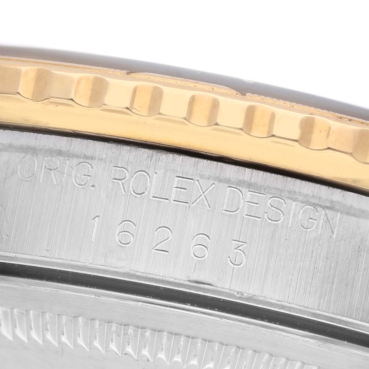 The image shows a close-up of the bezel and side engraving on a Rolex Turn-o-Graph 16263 Men's Steel and Gold (two tone) Black Dial watch, highlighting the model number.