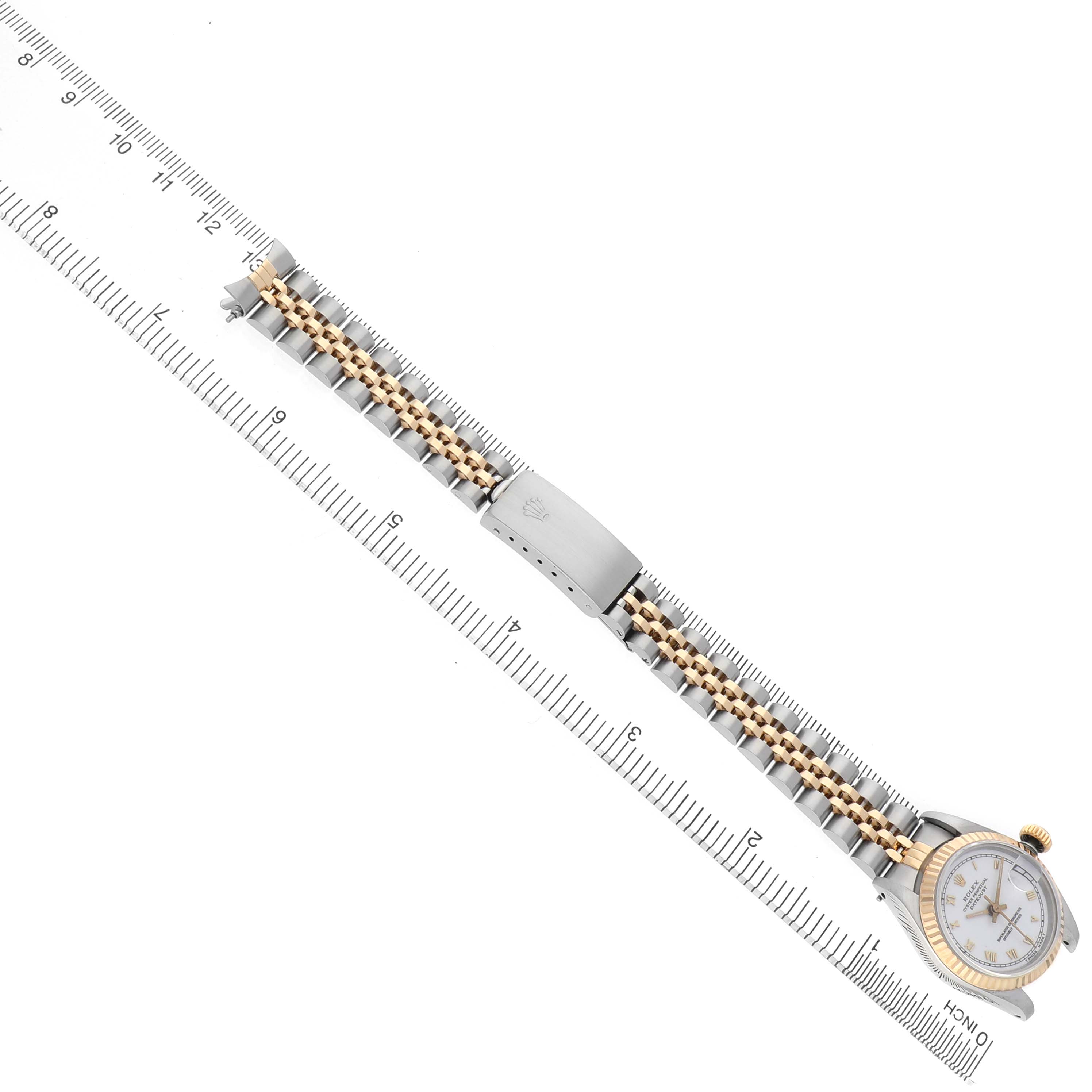 The Rolex Datejust 69173 Women's Steel and Gold (two tone) White Dial watch is shown fully extended, displaying the bracelet, clasp, and part of the face at an overhead angle.
