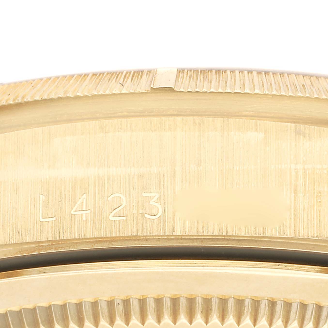 This image shows the side case and serial number area of a Rolex President 18248 Men's Yellow Gold Champagne Dial 18248 Men's Yellow Gold Champagne Dial model watch.