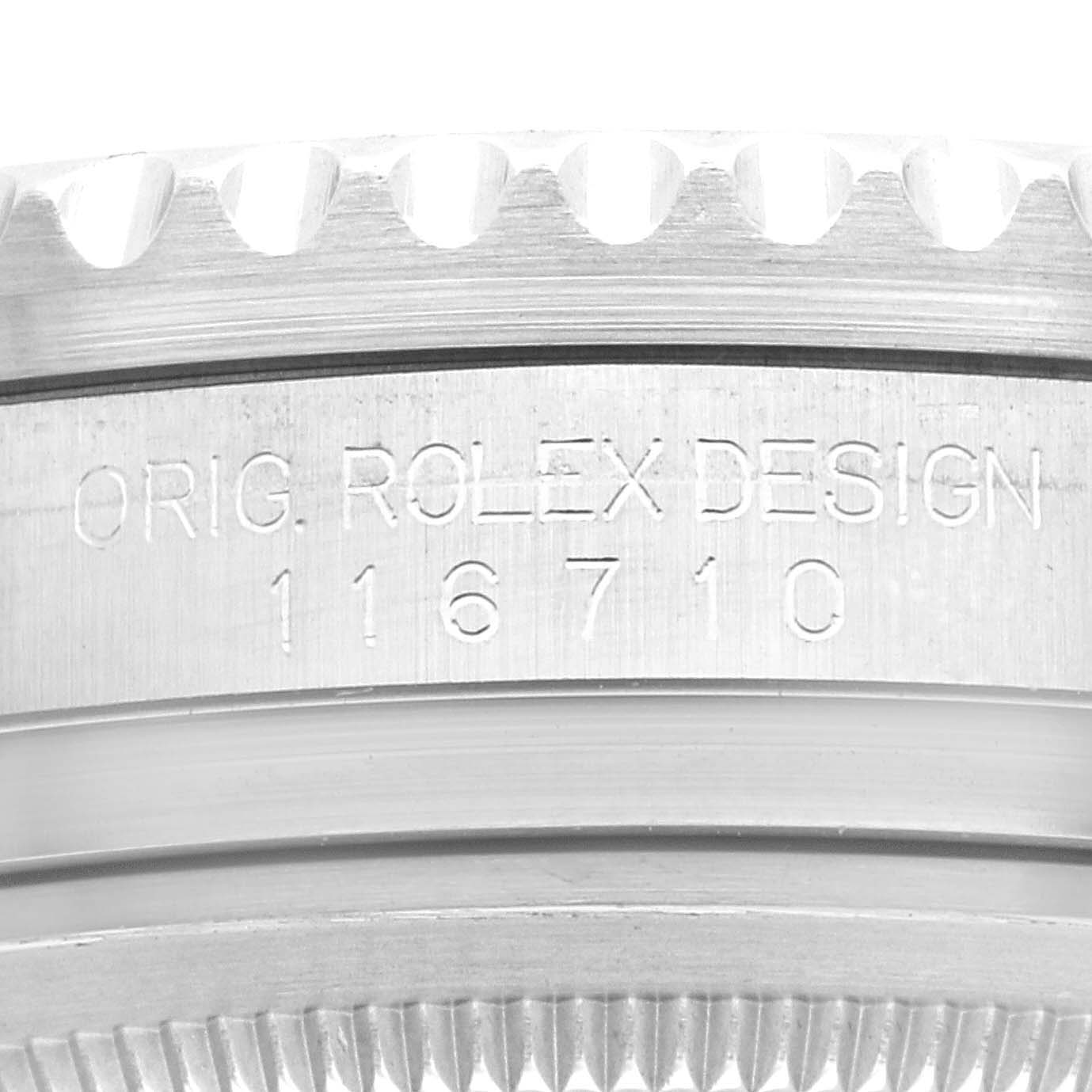 This close-up image shows the engraved original Rolex design serial number on the case of a Rolex GMT-Master 116710 Men
s Stainless Steel Black Dial 116710 Men
s Stainless Steel Black Dial watch.