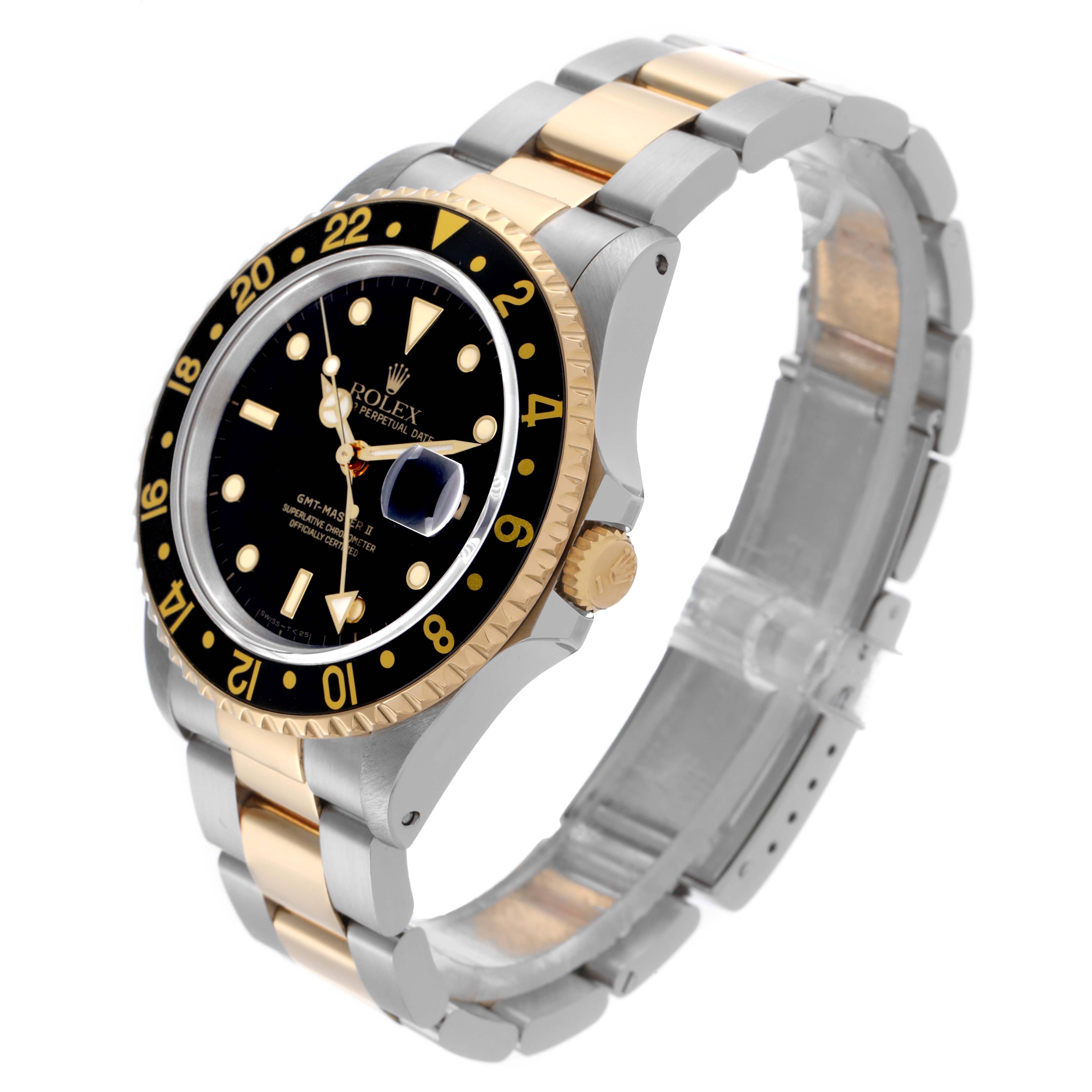 The Rolex GMT-Master 16713LN Men's Steel and Gold (two tone) Black Dial 16713LN Men's Steel and Gold (two tone) Black Dial watch is shown at a three-quarter angle, displaying the bezel, dial, and two-tone bracelet.