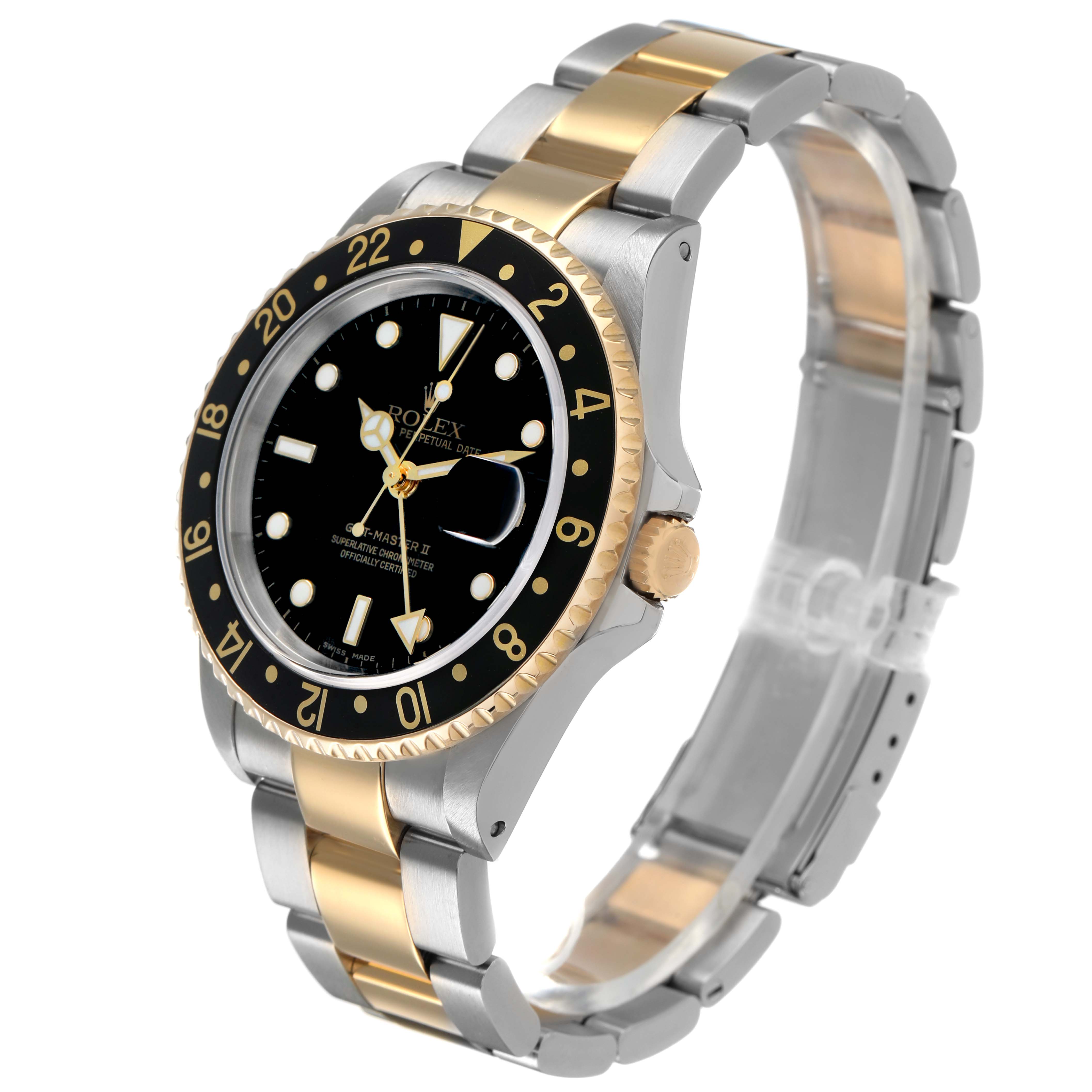 The Rolex GMT-Master 16713 Men's Steel and Gold (two tone) Black Dial is shown from an angled side view, highlighting the two-tone bracelet, bezel, and dial.