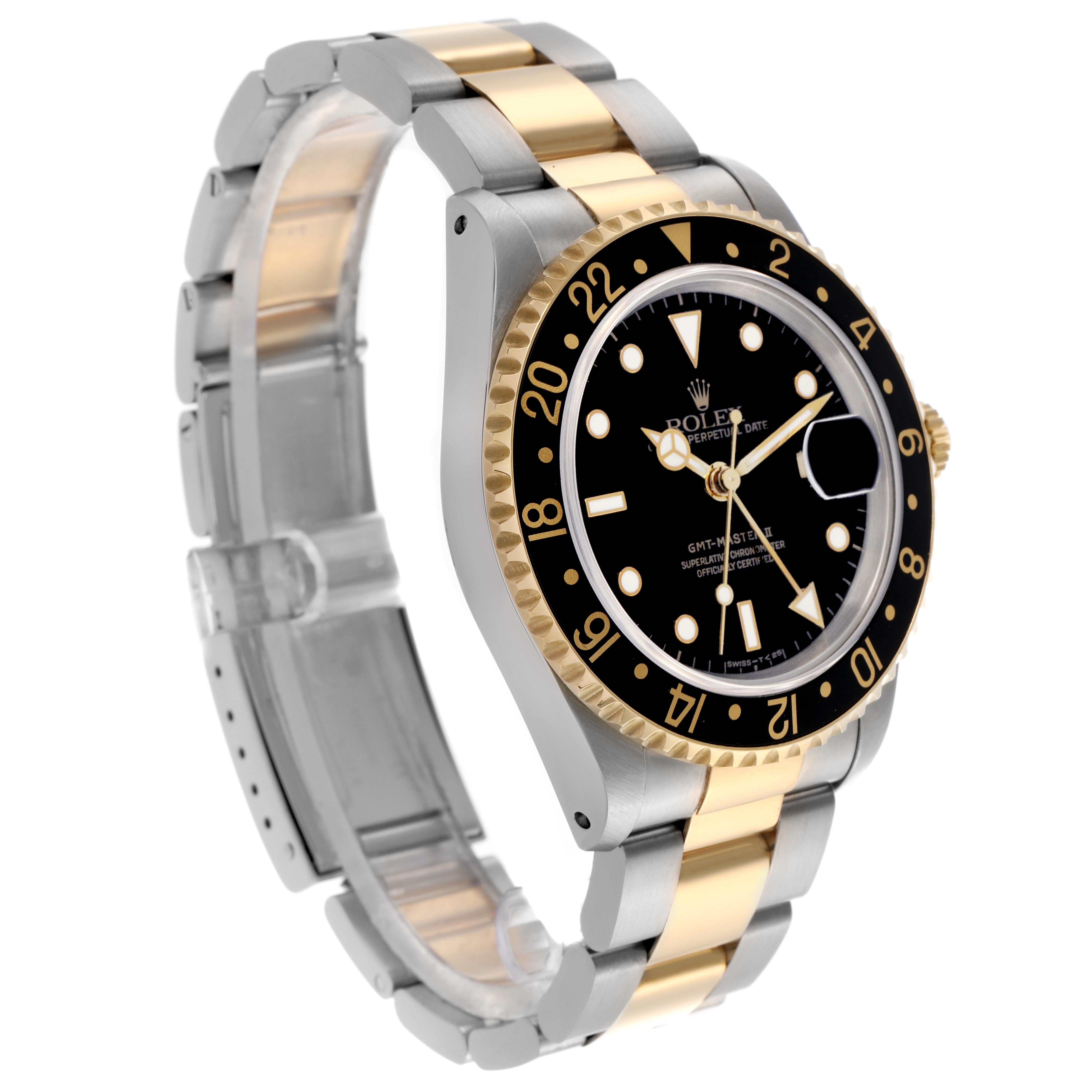 The Rolex GMT-Master 16713LN Men
s Steel and Gold (two tone) Black Dial 16713LN Men
s Steel and Gold (two tone) Black Dial is shown at a three-quarter angle, highlighting the bezel, dial, and two-tone bracelet.