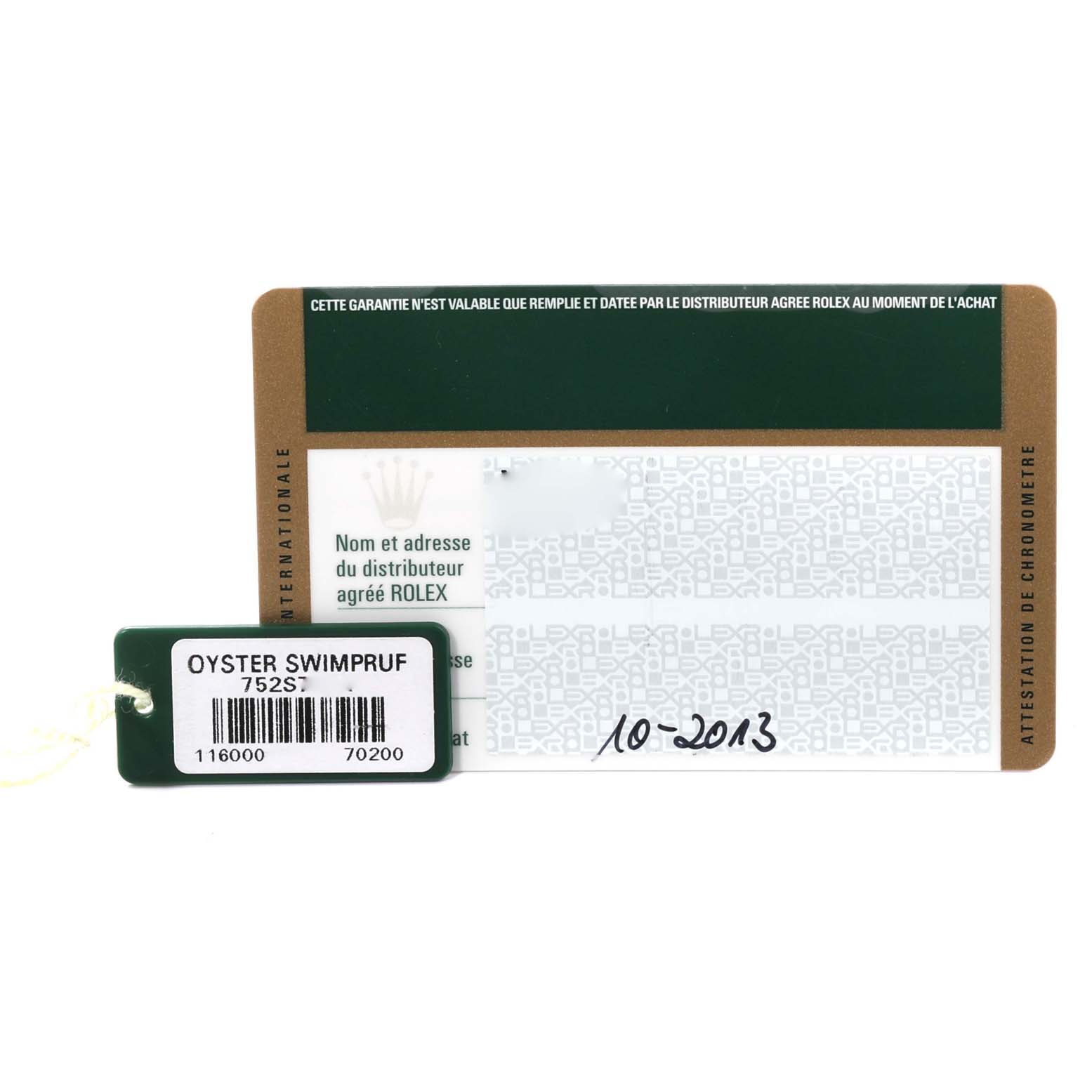 This image shows the warranty card and tag of a Rolex Oyster Perpetual 116000 Men
s Stainless Steel Blue Dial 116000 Men
s Stainless Steel Blue Dial watch.