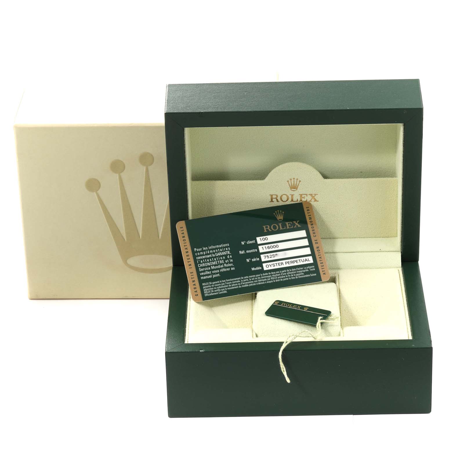 The image shows a Rolex Oyster Perpetual 116000 Men
s Stainless Steel Blue Dial 116000 Men
s Stainless Steel Blue Dial watch box at an angle, displaying the warranty card and accessories.