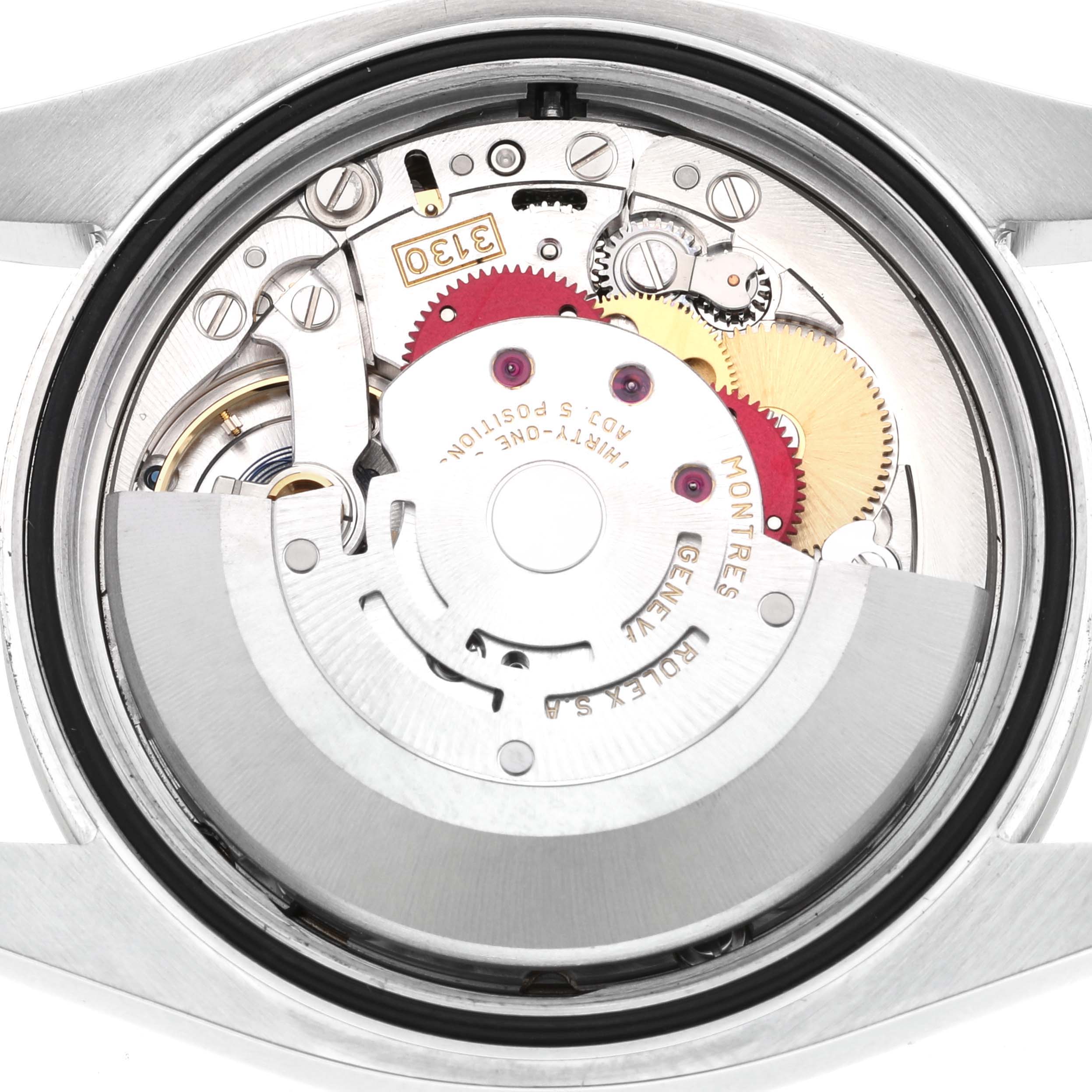 This image shows the internal movement and components of a Rolex Oyster Perpetual 116000 Men
s Stainless Steel Blue Dial 116000 Men
s Stainless Steel Blue Dial watch from a rear angle with the case back removed.