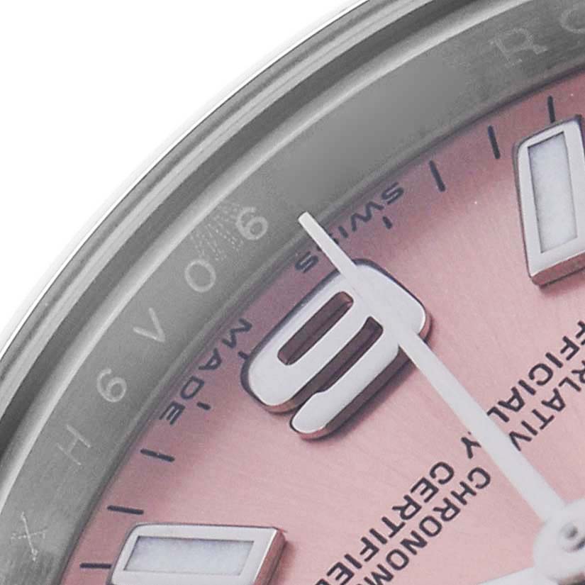 The image shows a close-up angle of the Rolex Oyster Perpetual 176200 Women's Stainless Steel Pink Dial 176200 Women's Stainless Steel Pink Dial watch's dial, highlighting the hour markers and part of the hands.