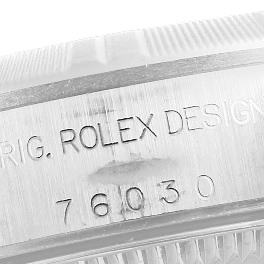 This image shows a close-up of the side casing of a Rolex Oyster Perpetual 76030 Women's Stainless Steel Pink Dial 76030 Women's Stainless Steel Pink Dial watch, highlighting the engraved model number, "76030."