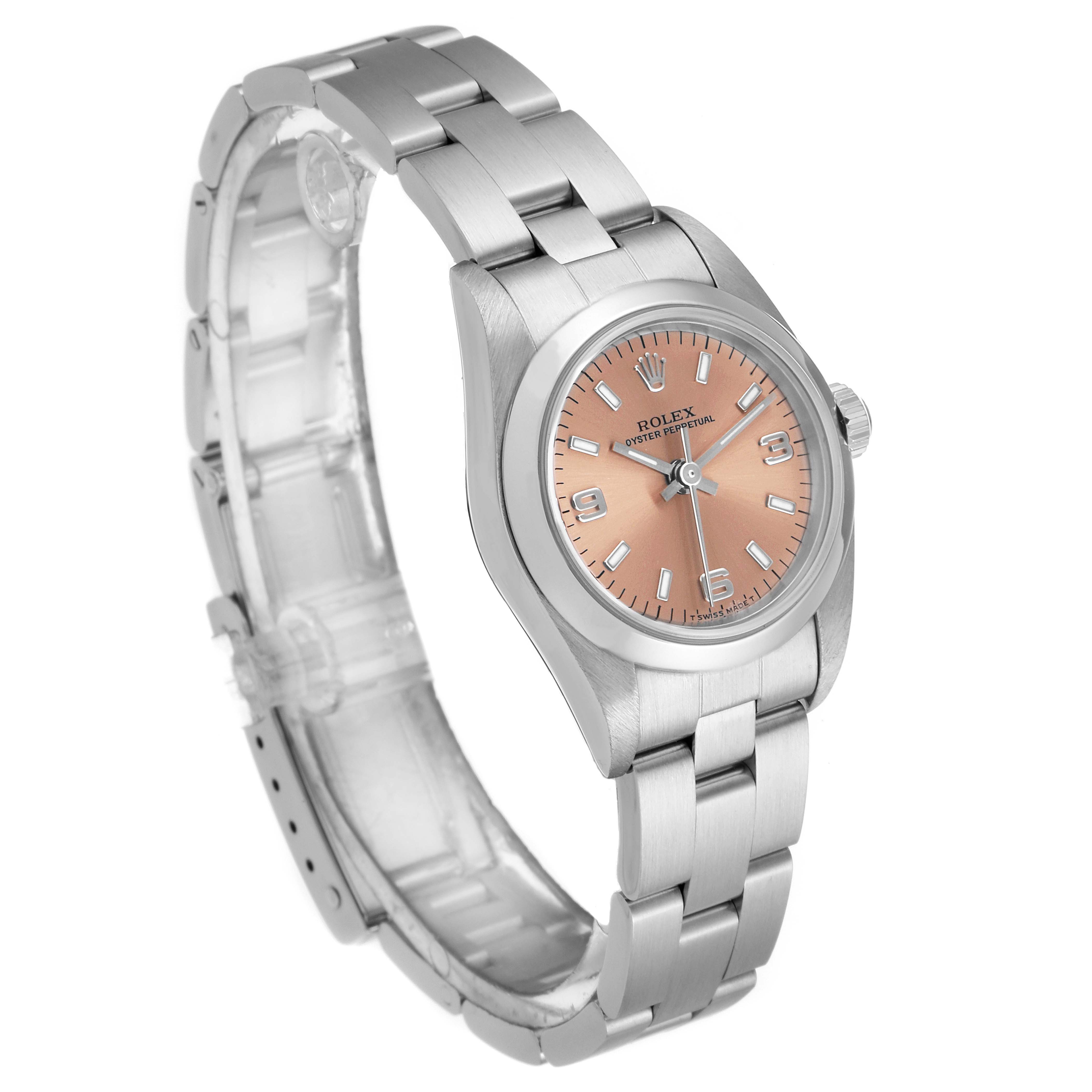 The Rolex Oyster Perpetual 76080 Women's Stainless Steel Pink Dial 76080 Women's Stainless Steel Pink Dial watch is shown from an angled side view, highlighting its bracelet, case, and dial.