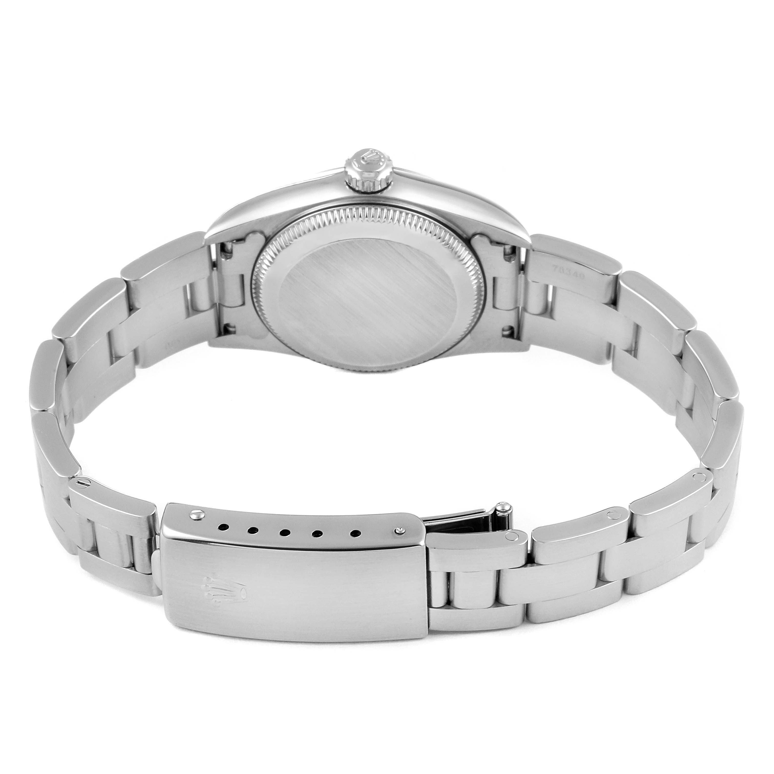 The image shows the back and clasp of a Rolex Oyster Perpetual 76080 Women's Stainless Steel Pink Dial 76080 Women's Stainless Steel Pink Dial watch, featuring its metal bracelet and case back.