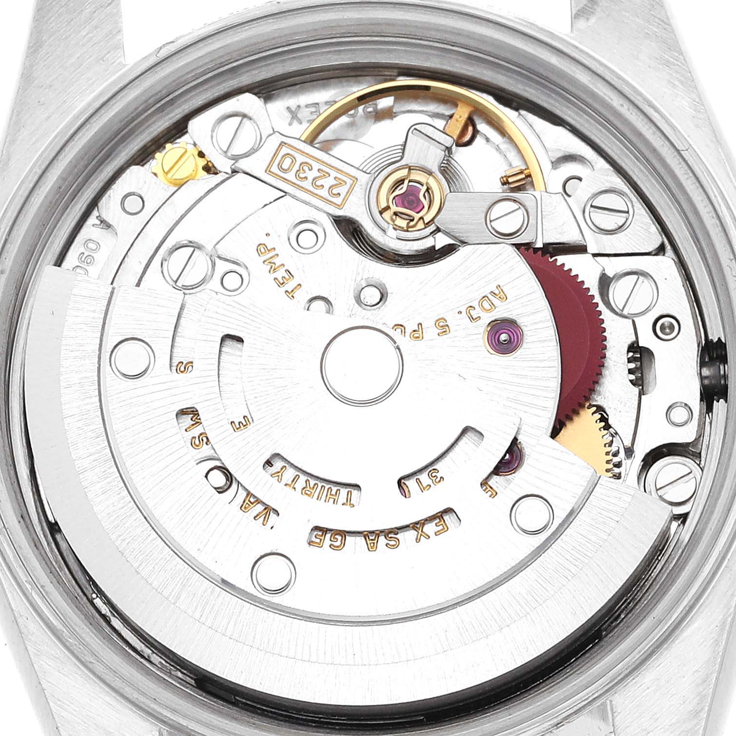 This is an inside view of the Oyster Perpetual model by Rolex, showing its intricate movement and mechanical parts.