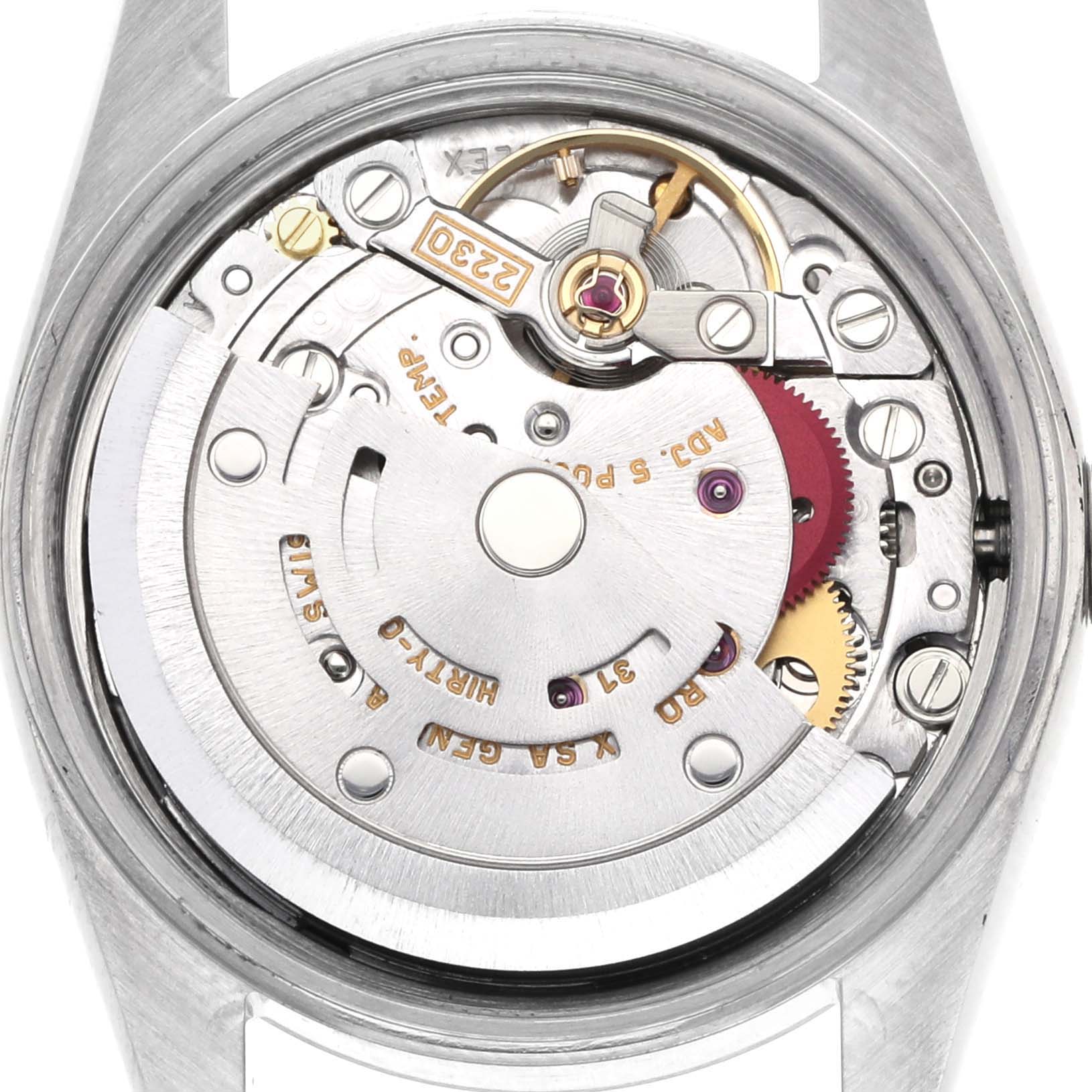 The image shows the movement mechanism of a Rolex Oyster Perpetual 76080 Women's Stainless Steel White Dial 76080 Women's Stainless Steel White Dial watch from the back, displaying gears and inscriptions.