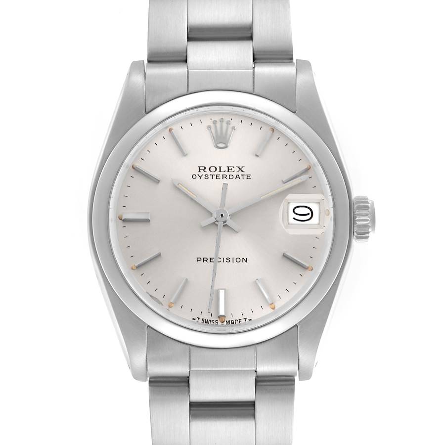 The Rolex Date watch is shown from a front angle, displaying the dial, bezel, crown, and part of the bracelet.