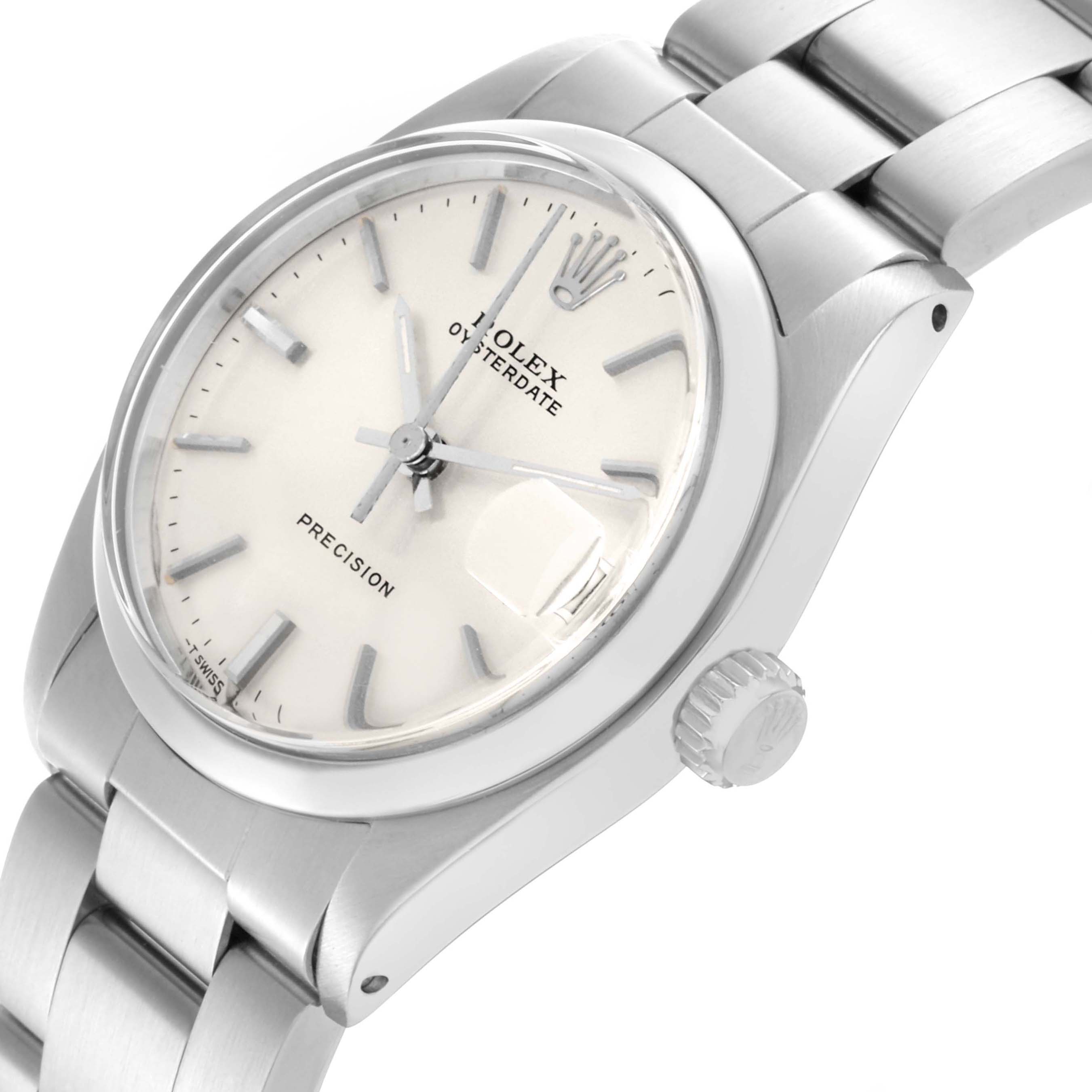 The Rolex Date 6466 Women's Stainless Steel Silver Dial 6466 Women's Stainless Steel Silver Dial watch is shown at an angled view, highlighting the face, bezel, crown, and part of the bracelet.