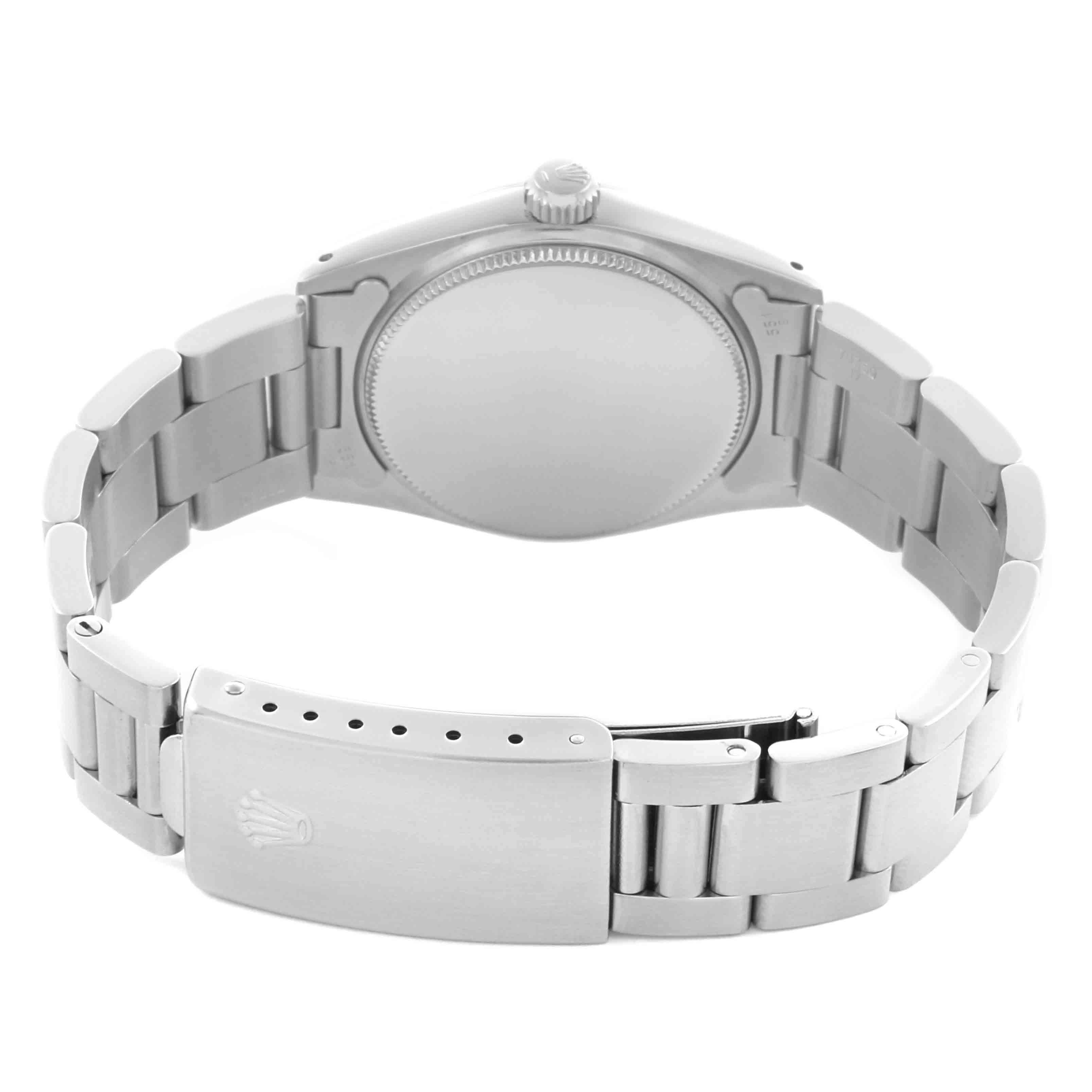 The Rolex Date 6466 Women's Stainless Steel Silver Dial 6466 Women's Stainless Steel Silver Dial model watch is shown from the back, highlighting the clasp, bracelet, and screw-down case back.