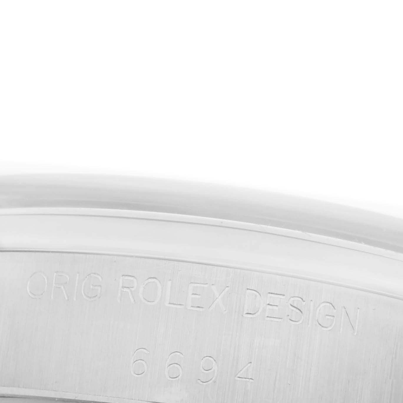 The image shows a close-up of the case or bezel inscription for the Rolex Date 6694 Men's Stainless Steel Silver Dial 6694 Men's Stainless Steel Silver Dial model, highlighting its design and model number.