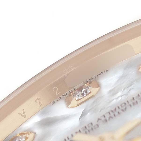 This close-up image shows the dial and edge of a Rolex Pearlmaster 81298 Women's Yellow Gold Mother of Pearl Dial watch, highlighting diamond markers and partial text engraving.
