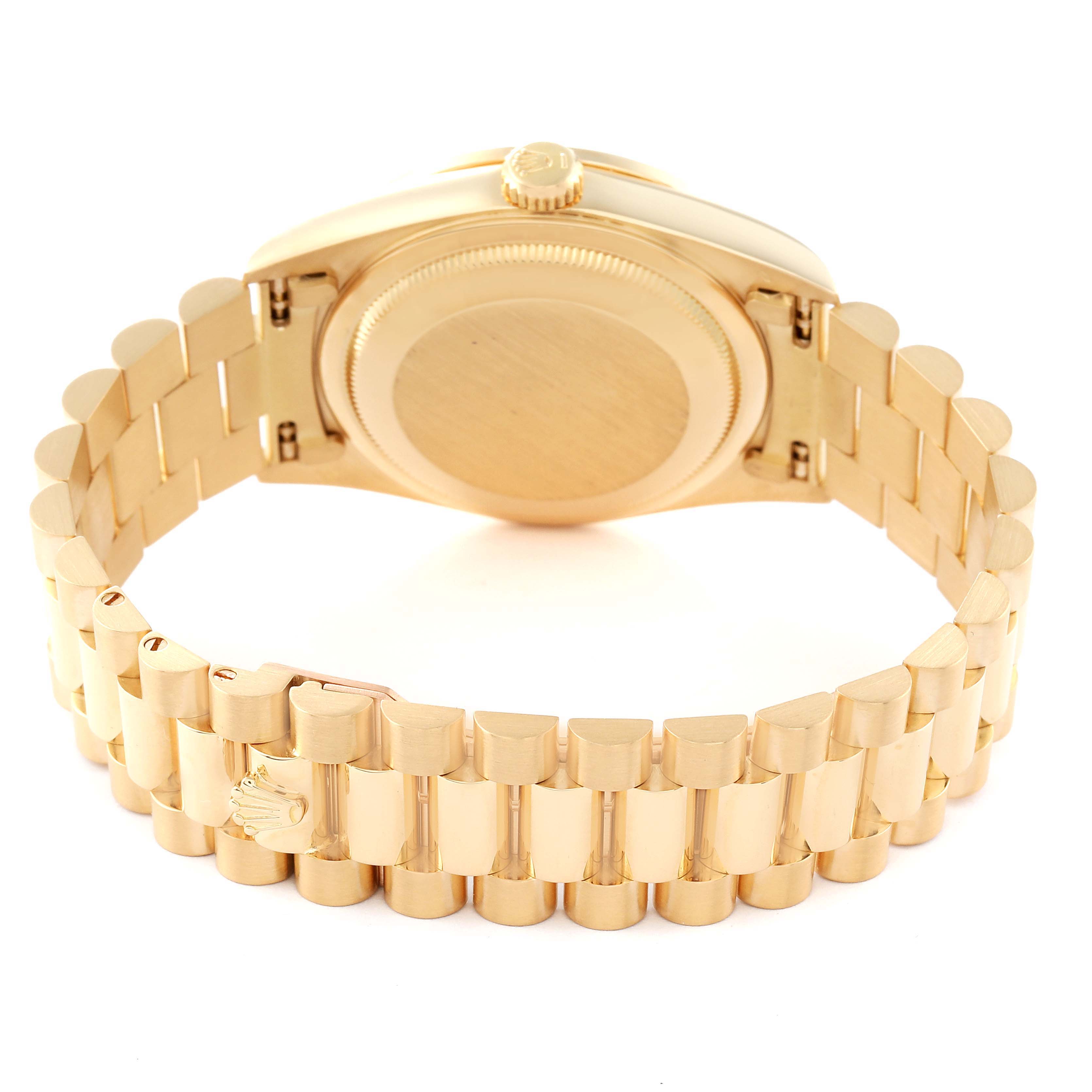 The image shows the rear casing and bracelet of a Rolex President 18348 Men
s Yellow Gold Champagne Dial 18348 Men
s Yellow Gold Champagne Dial model watch, highlighting its gold finish and clasp.