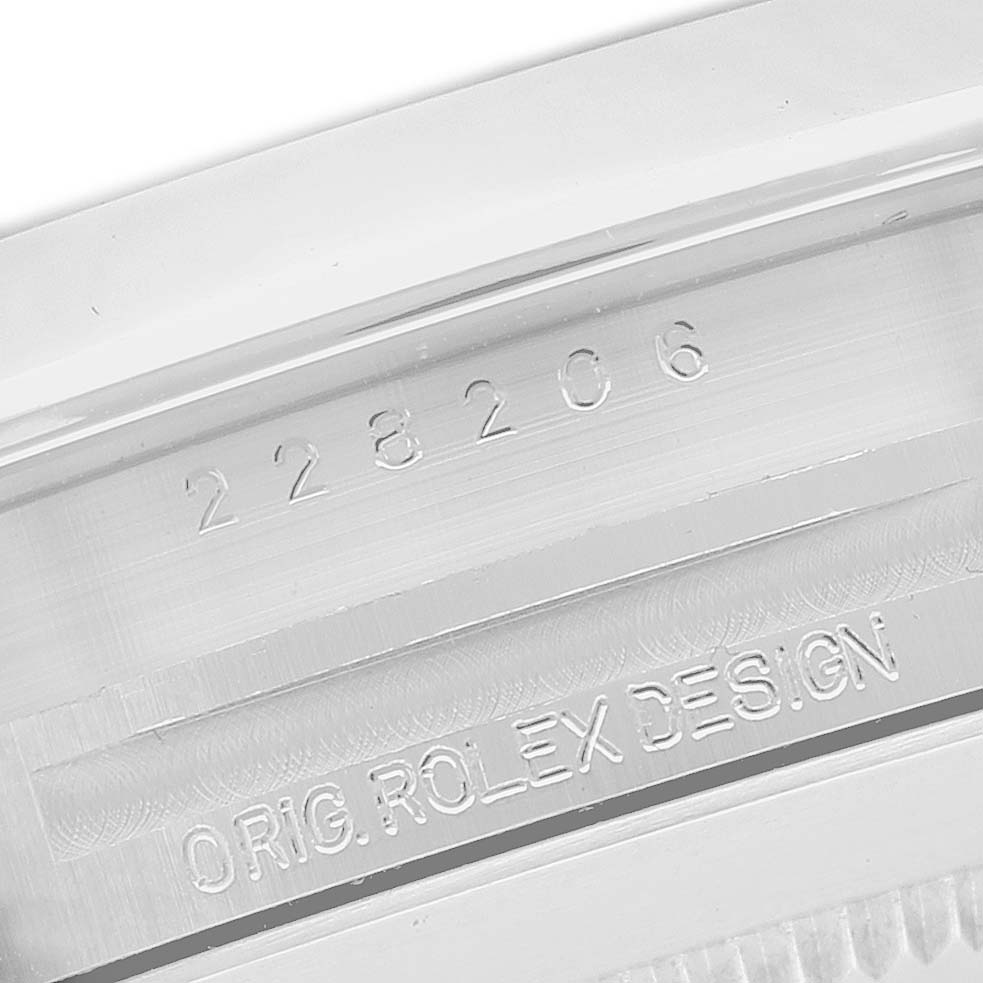 The image shows the side engraving on the case of a Rolex President 228206 Men's Platinum Silver Dial model, displaying the serial number and "ORIG. ROLEX DESIGN."