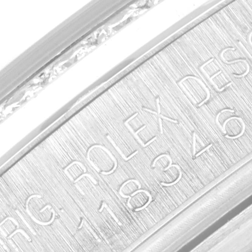 This close-up image shows the inner engraving of a Rolex President 118346 Men's Platinum Silver Dial 118346 Men's Platinum Silver Dial model watch, displaying the brand name and model number.