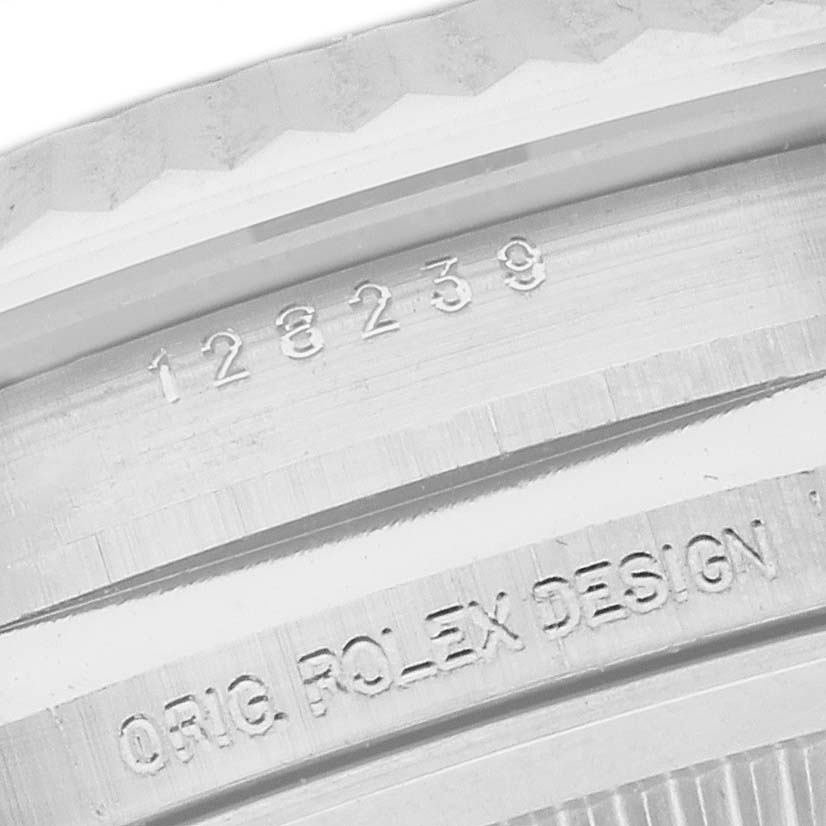 The image shows a close-up of the Rolex President 128239 Men
s White Gold Blue Dial 128239 Men
s White Gold Blue Dial watch
s engraved reference number and design details on the outer rim.