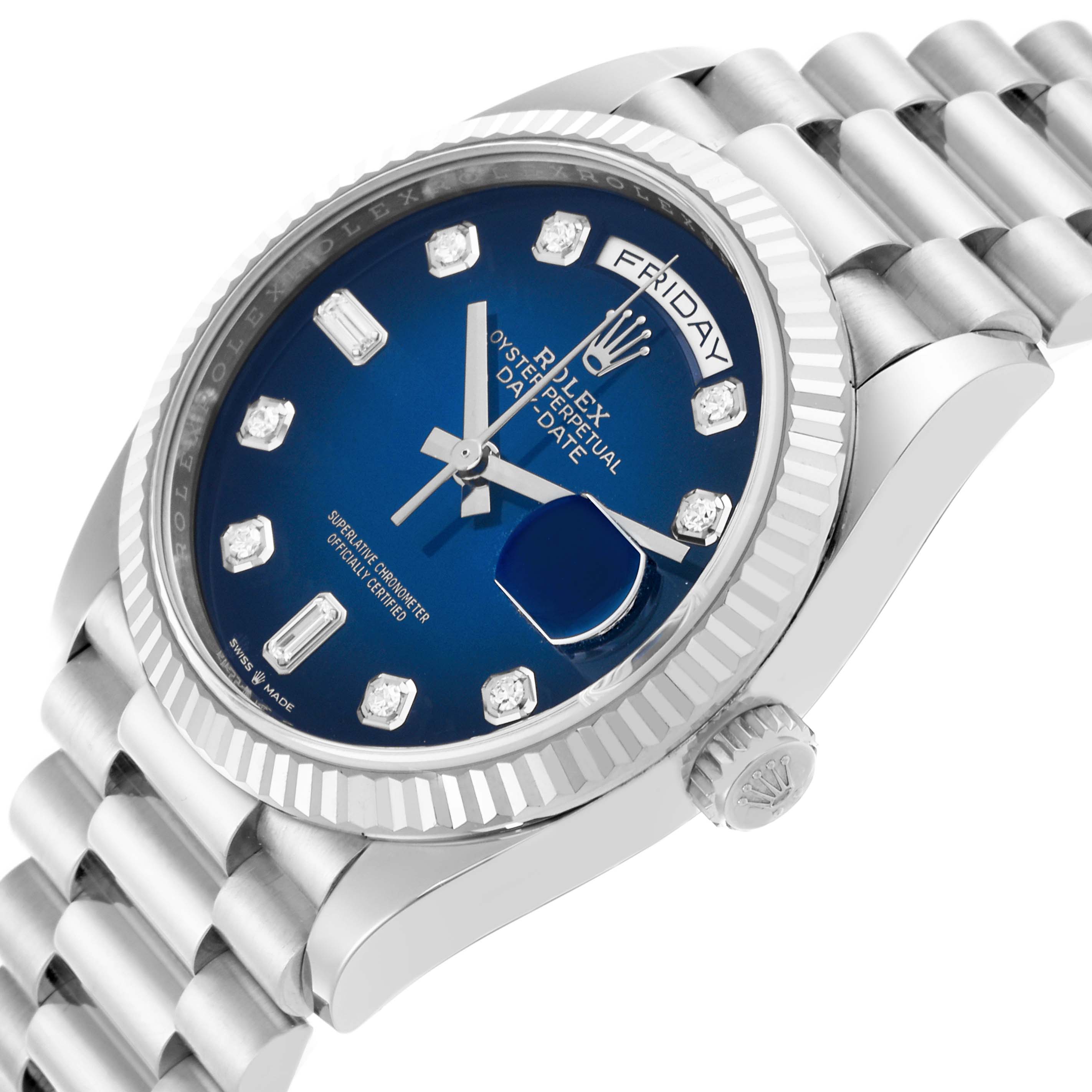 The Rolex President 128239 Men
s White Gold Blue Dial 128239 Men
s White Gold Blue Dial watch is shown at an angled side view, highlighting the blue dial, diamond markers, and the fluted bezel.