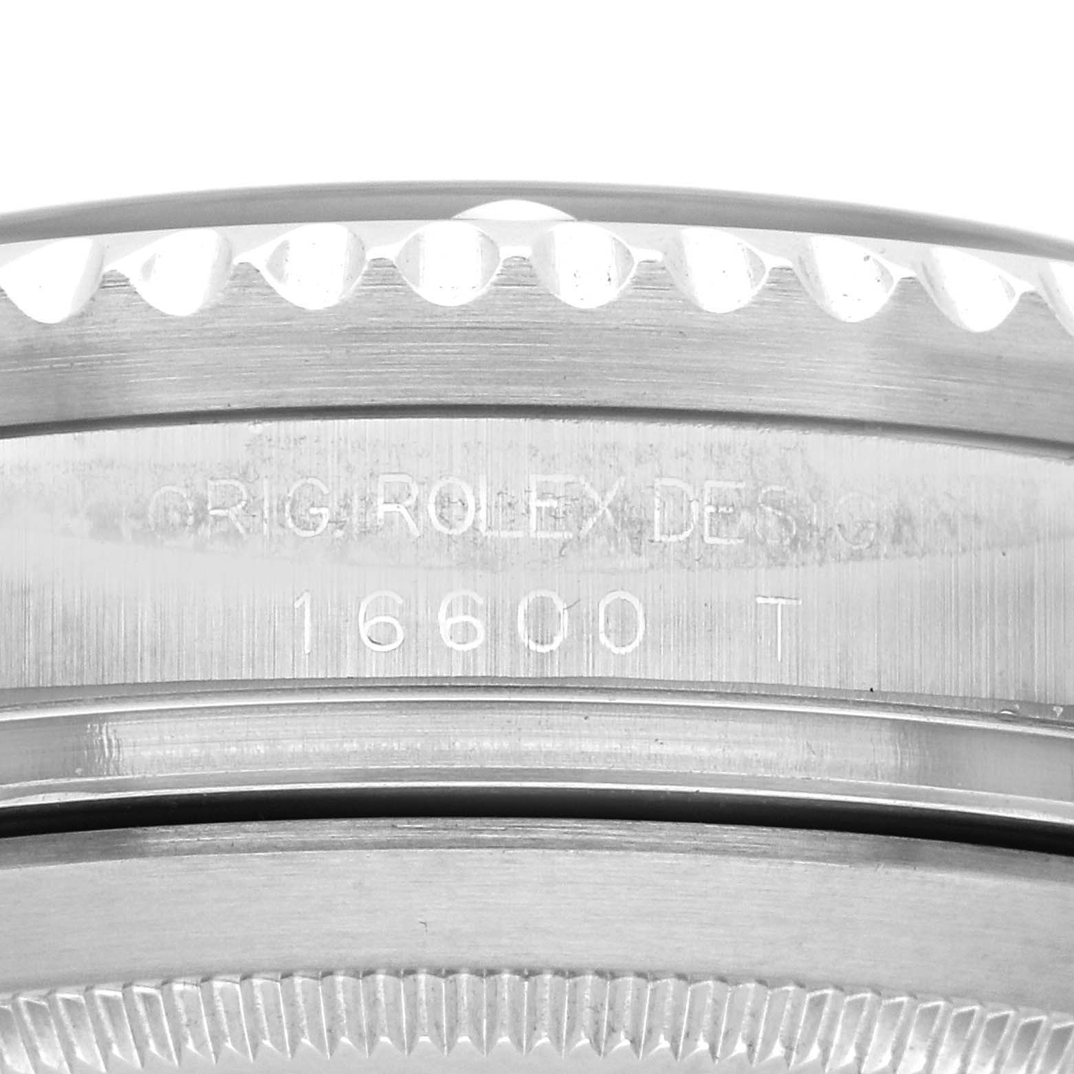 The image shows a close-up side view of the Rolex Sea-Dweller 16600 Men's Stainless Steel Black Dial 16600 Men's Stainless Steel Black Dial's engraved case, highlighting model number 16600 T.